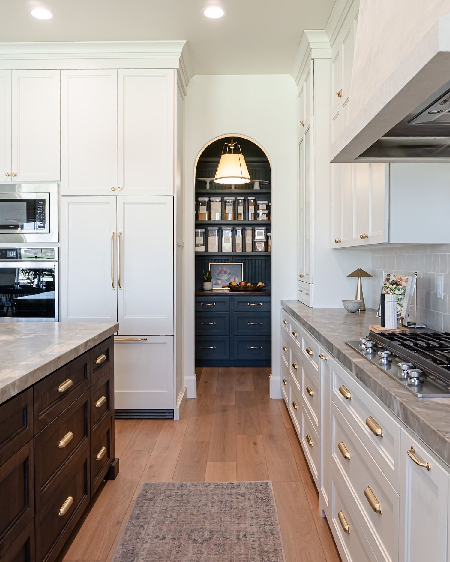 Custom pantry arch case opening in a modern french style kitchen in Lehi Utah