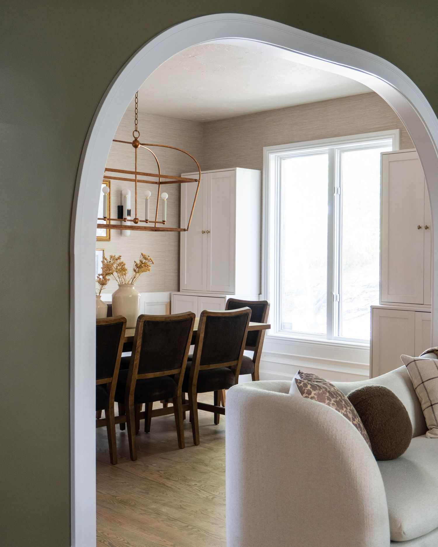 Peeking through the front sitting room to the dining room in an historic home in Provo Utah in a full remodeled home