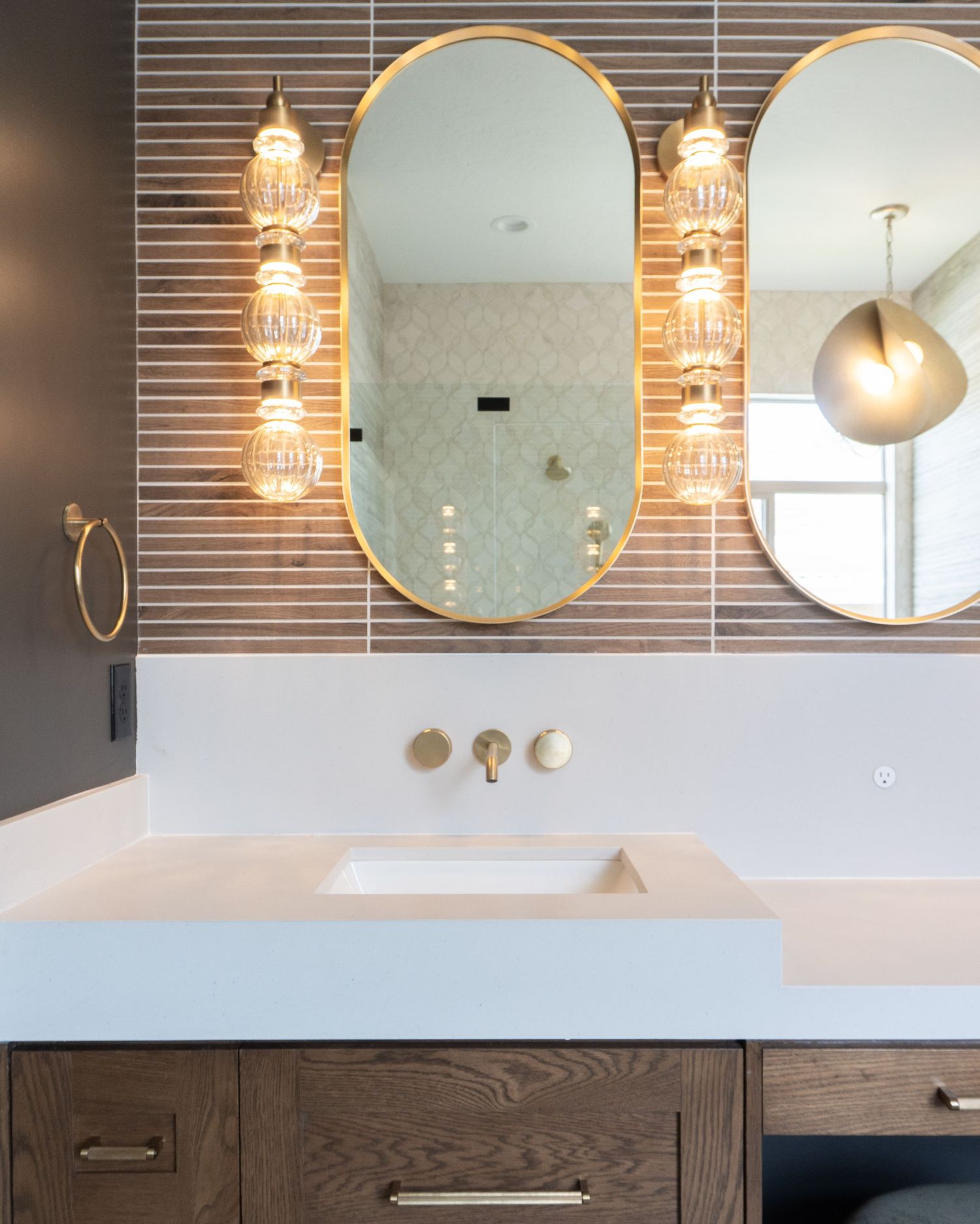 Bathroom remodel with the custom sconces shining in Provo Utah.