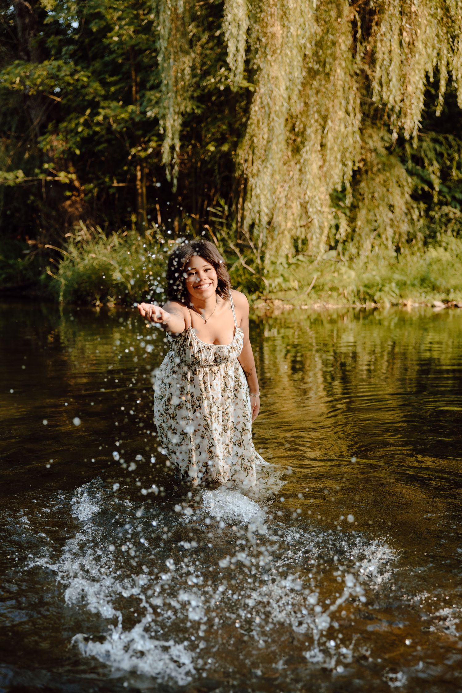 Water splashes dramatically during a creative pond photoshoot.
