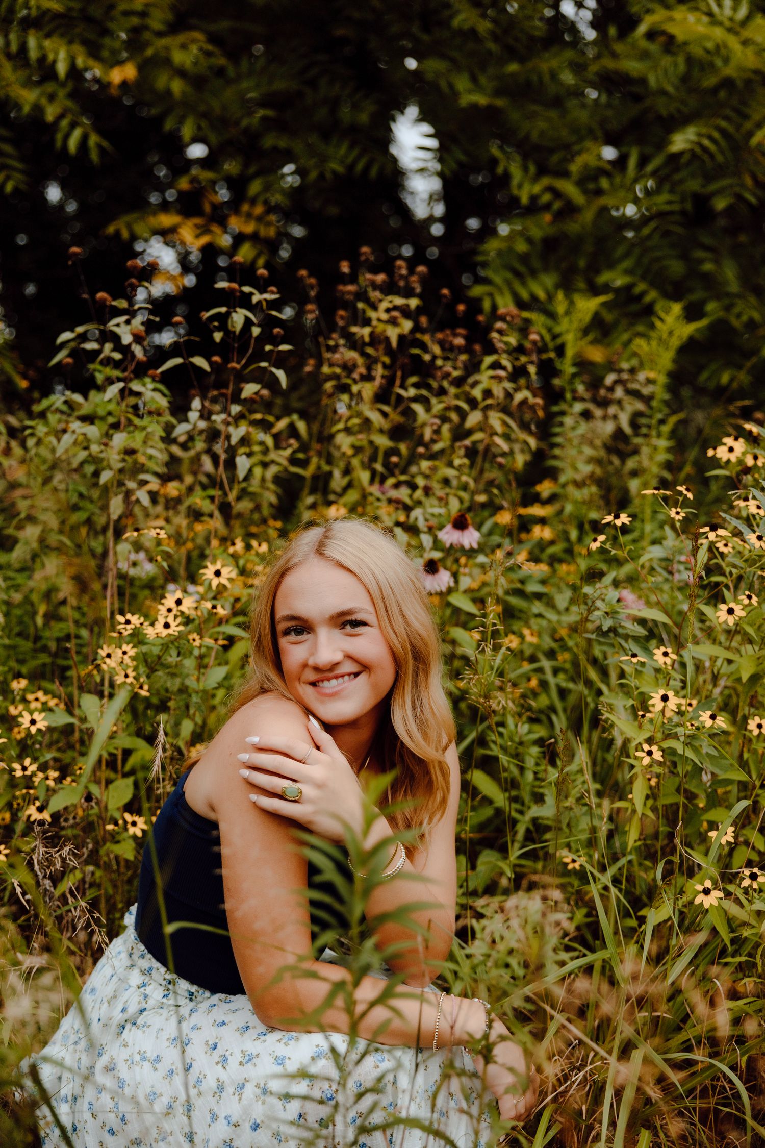 Natural lifestyle portrait taken in a field of wild summer flowers.