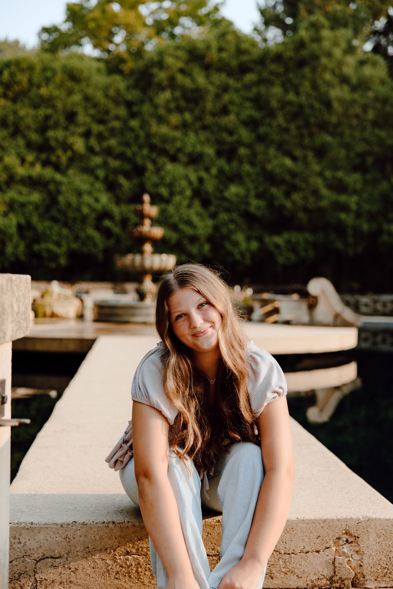Portrait series on a concrete structure in natural outdoor lighting.