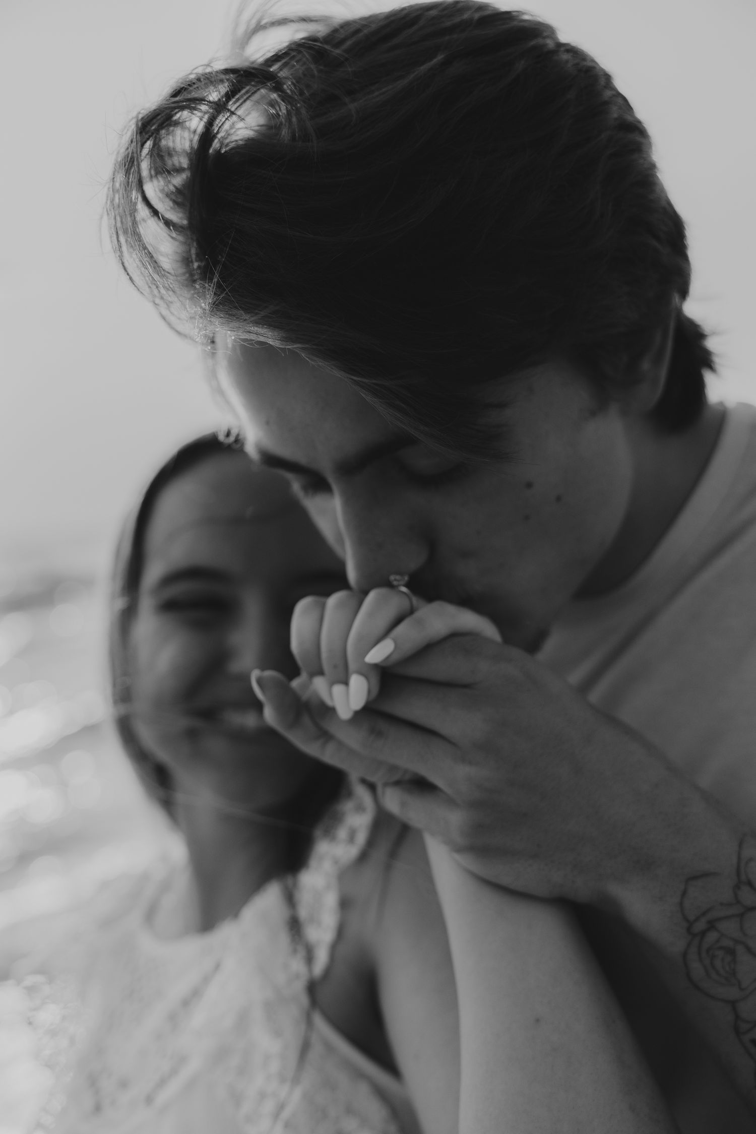An intimate black and white portrait capturing a tender moment.