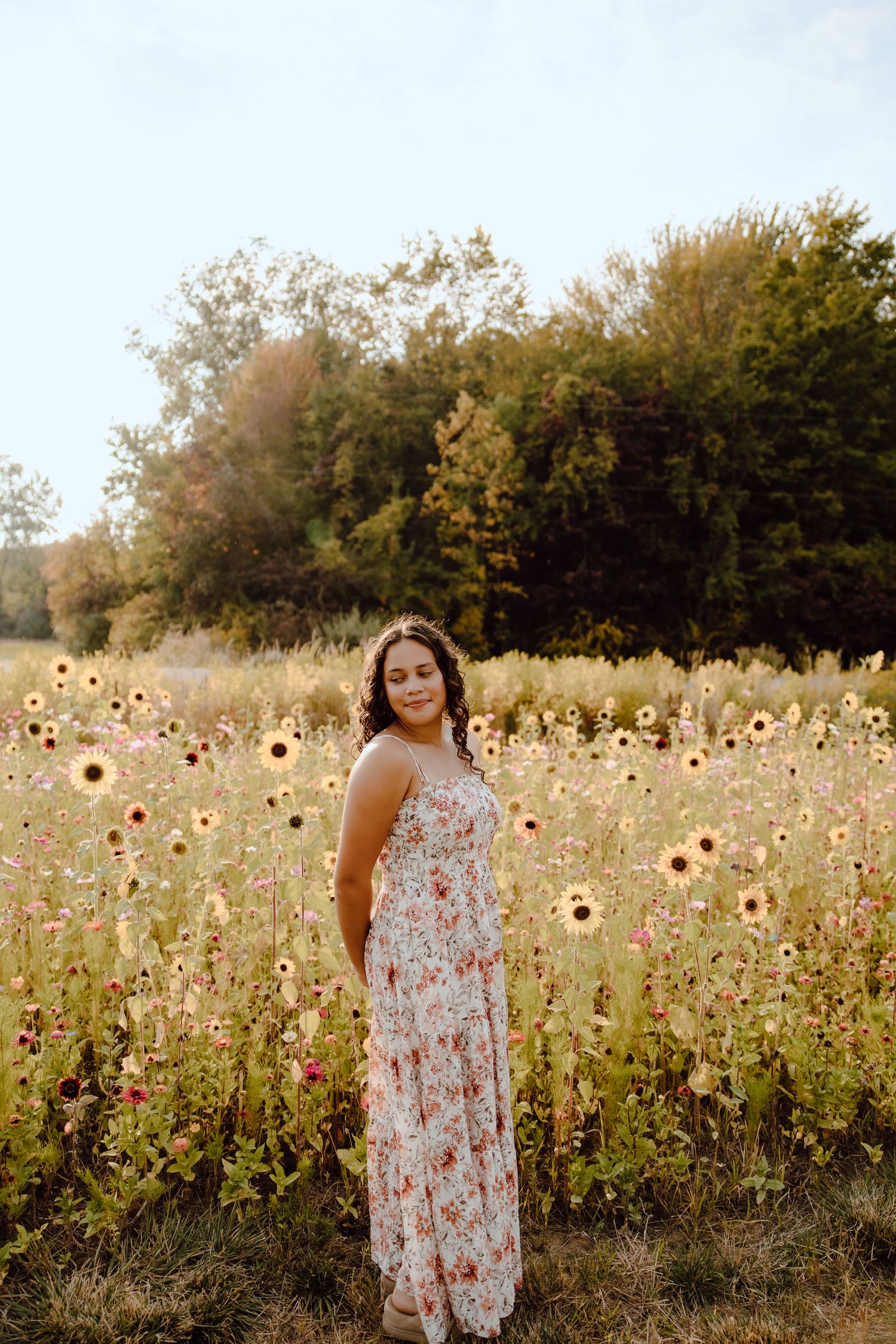Sunflowers and wildflowers create a natural backdrop in a serene summer field.