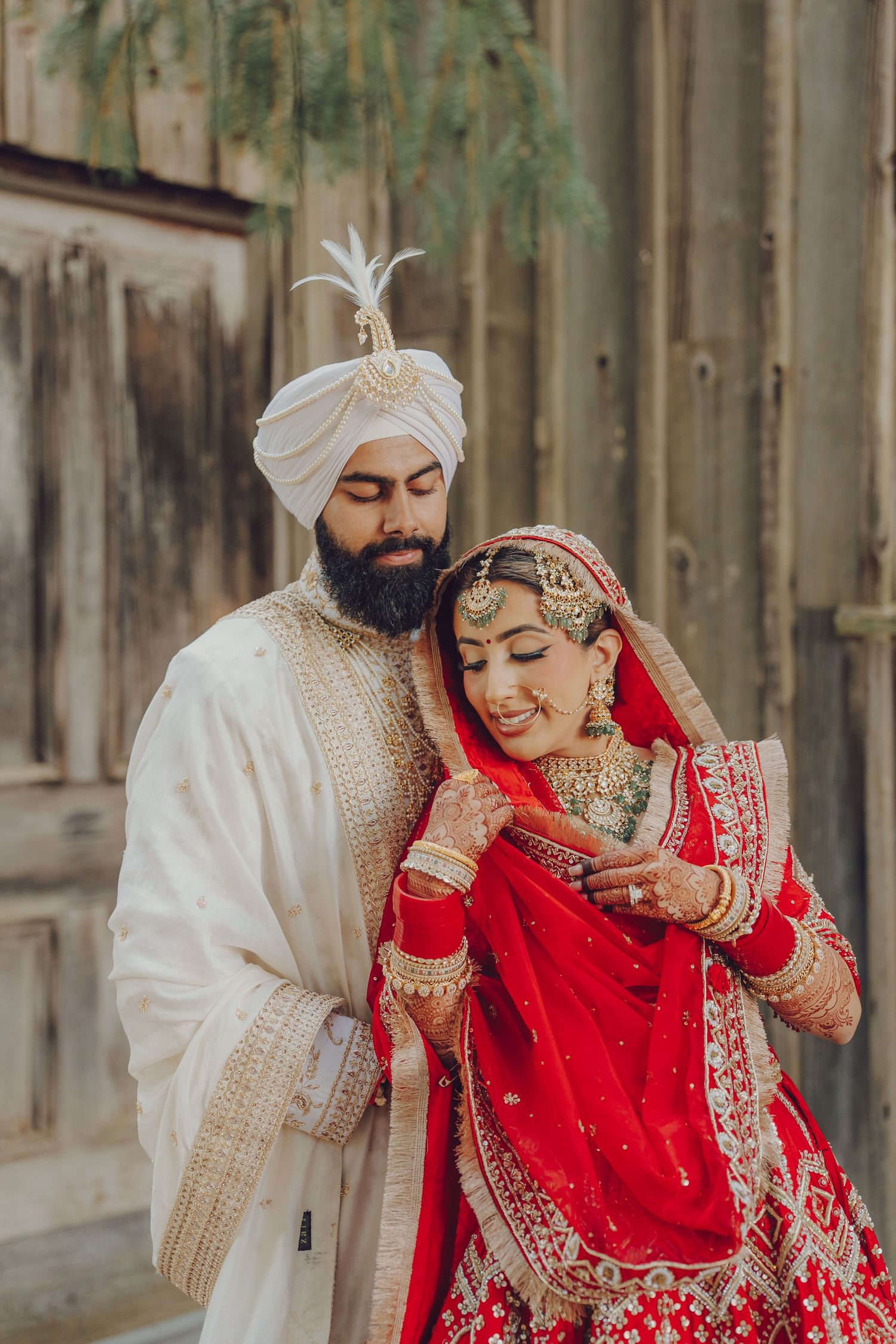 Candid moments of a Sikh wedding couple in traditional red and white outfits.