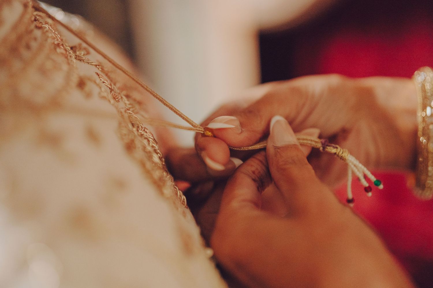 A close-up detail shot of traditional Indian bridal jewelry and accessories.