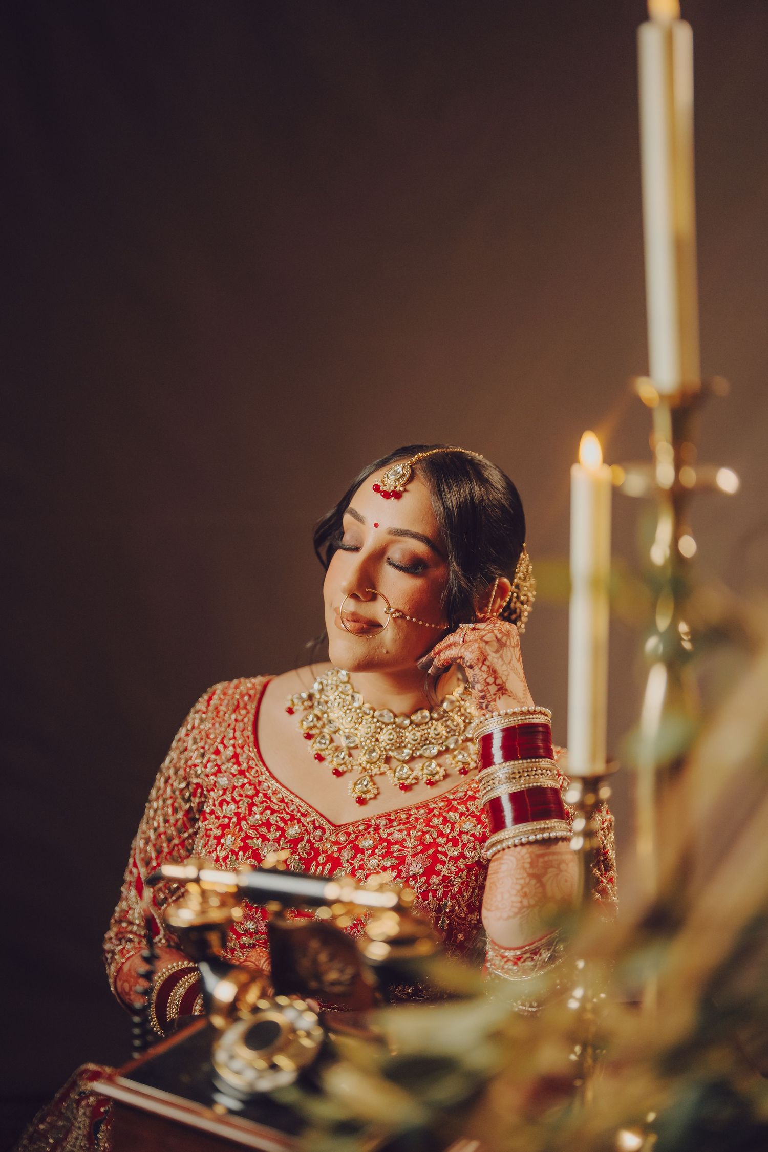 Close-up shots of traditional Indian bridal jewelry and makeup details in red and gold tones.