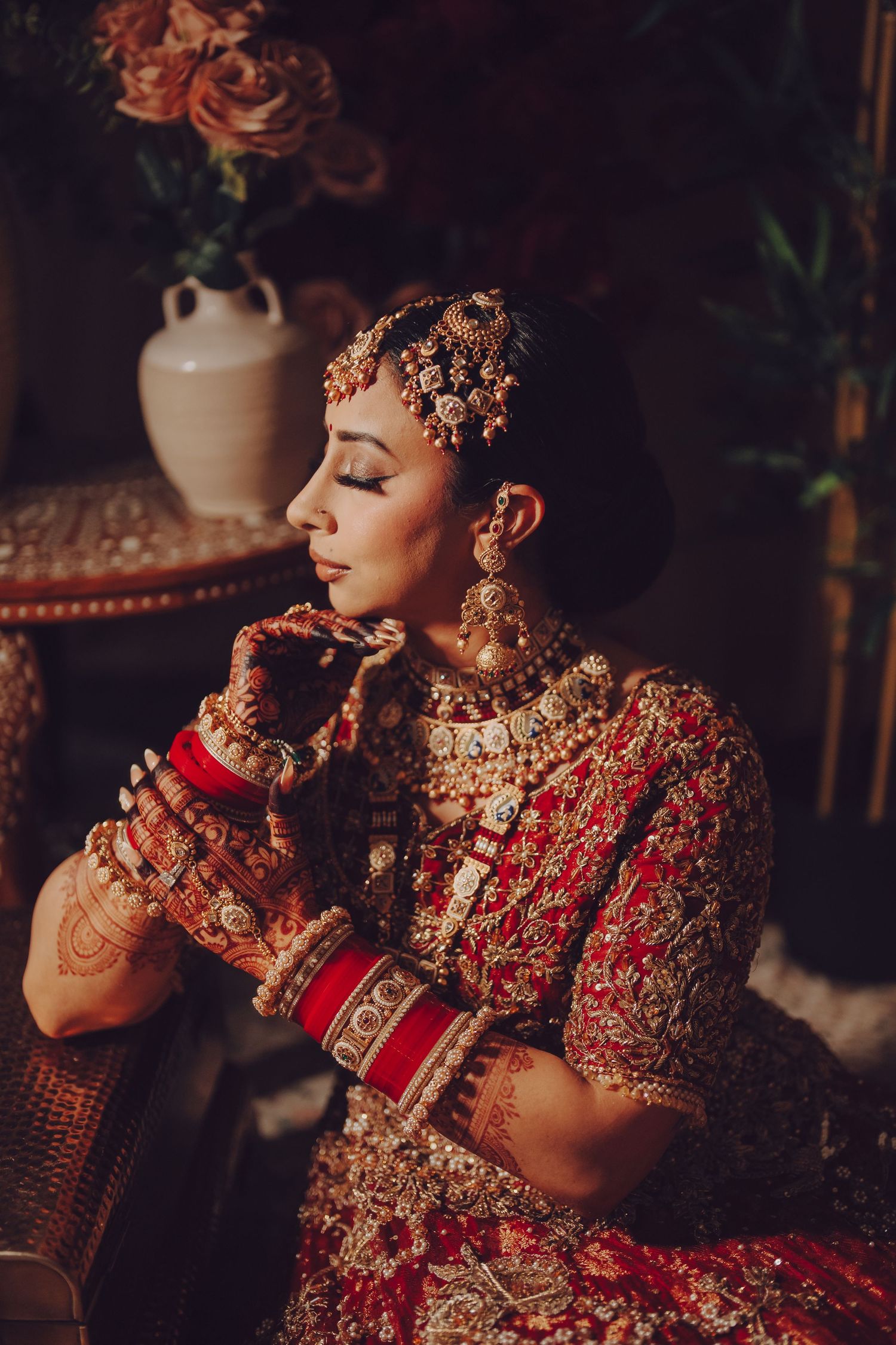 Artistic portrait series of traditional South Asian bridal jewelry and attire in warm lighting.