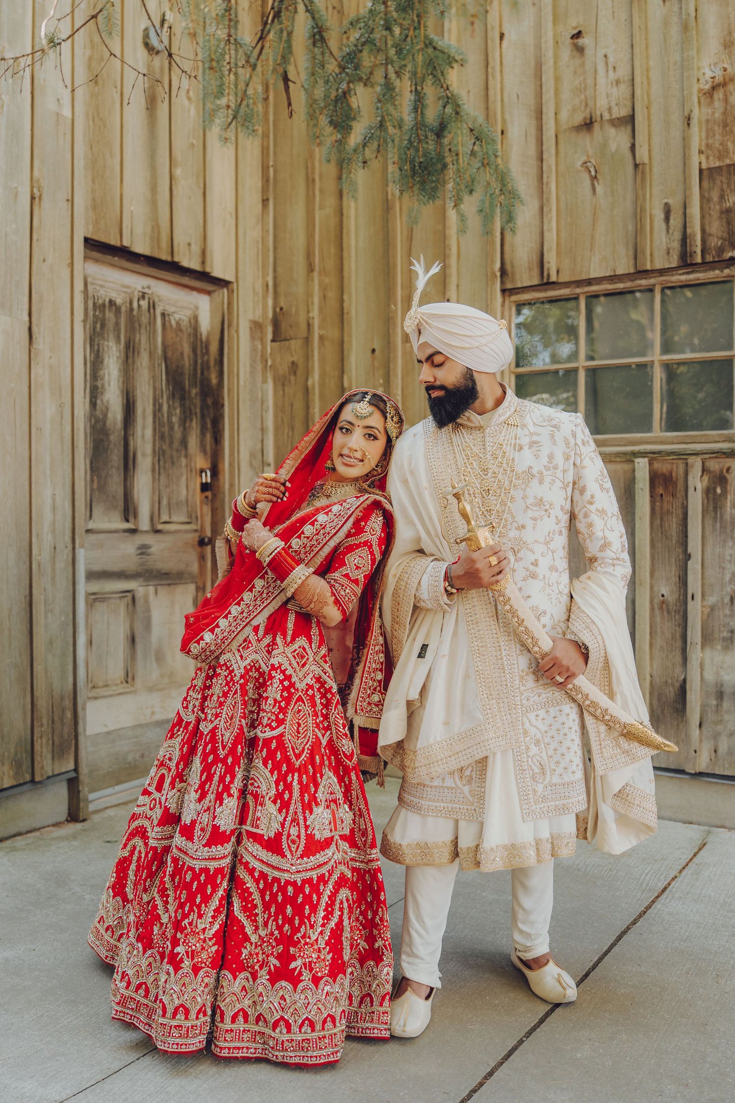 Wedding couple in traditional Sikh dress posing against wooden wall in artistic sequence.