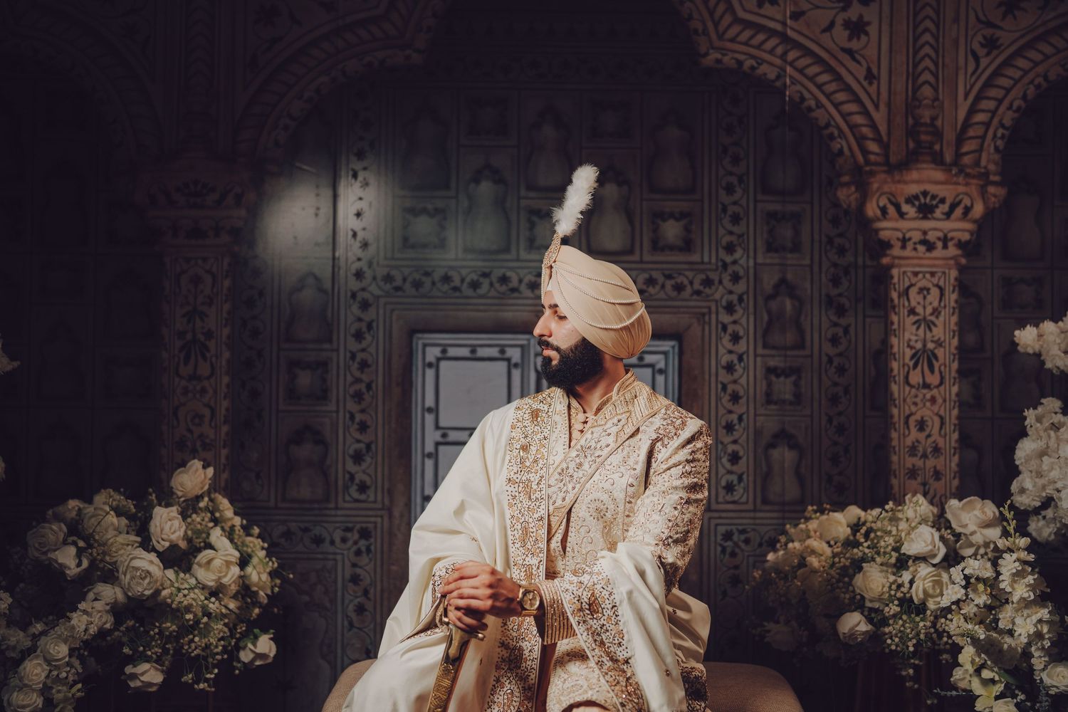 Wedding ceremony setup with traditional decor and ornate architectural details.