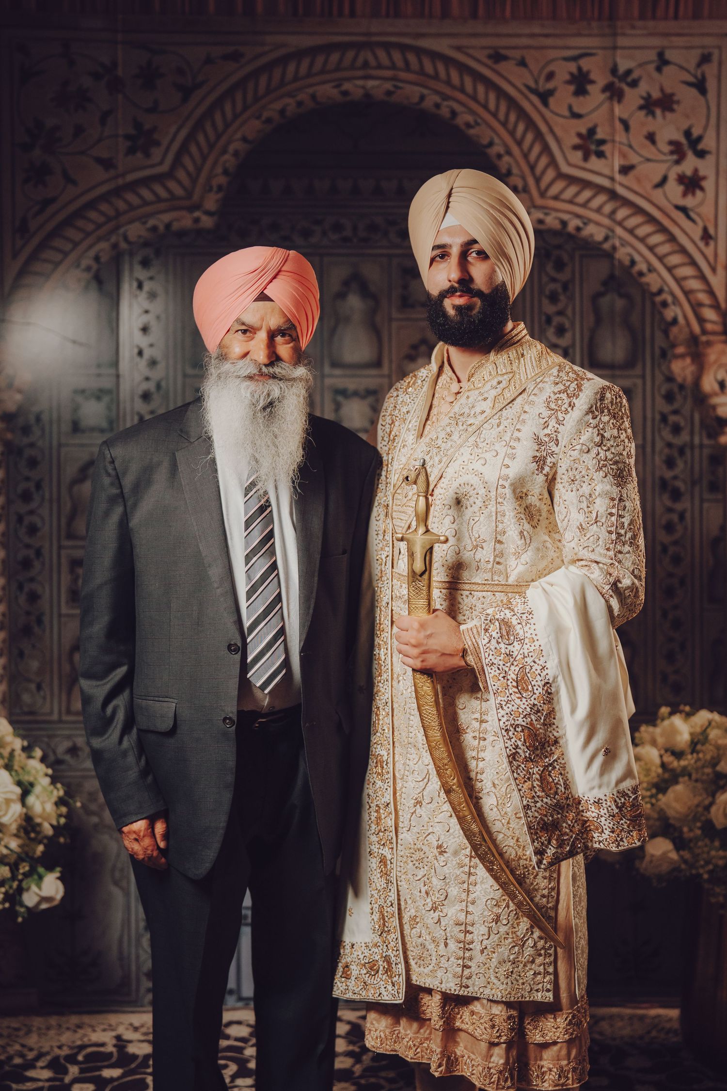 Family members gather for formal wedding portraits in traditional Sikh attire.