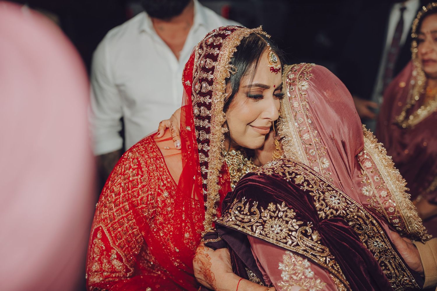 Candid moments from an Indian wedding celebration with guests and traditional attire.