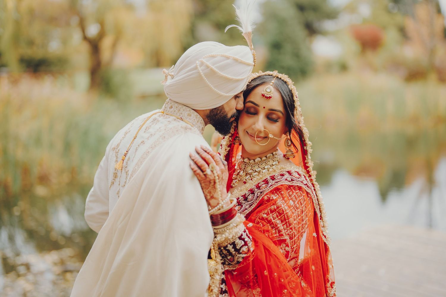 Outdoor wedding photography session with traditional Indian bridal attire in nature.