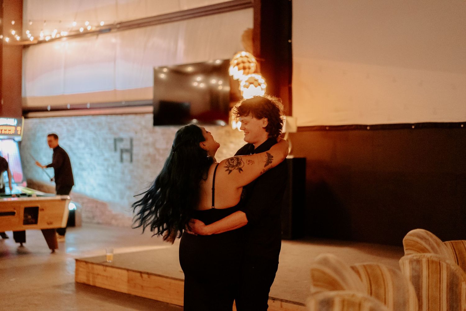 Newly married couple dances at their reception