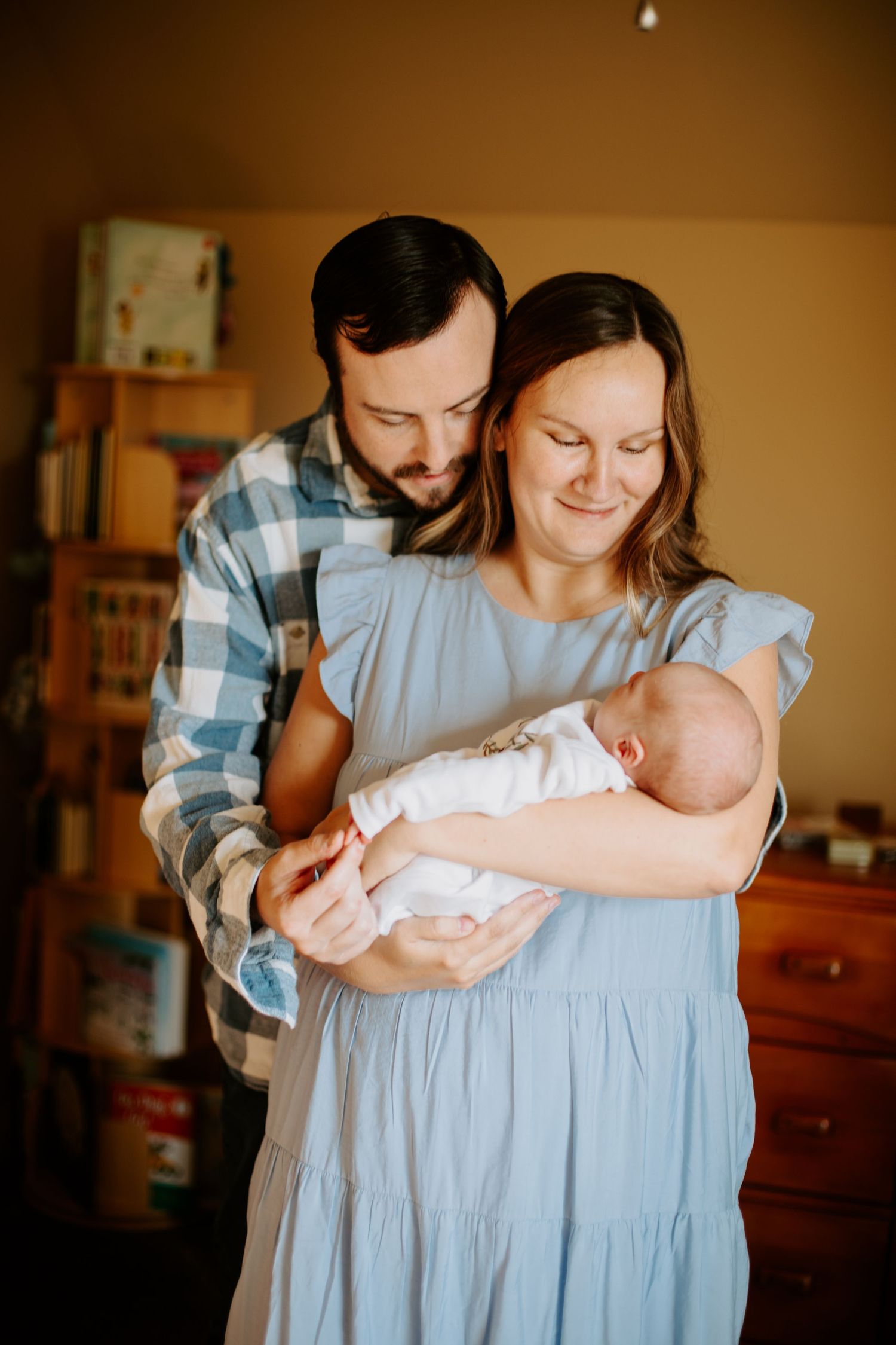 New parents hold their son in the nursery, Richmond photographer, rachel gorth, armory photography