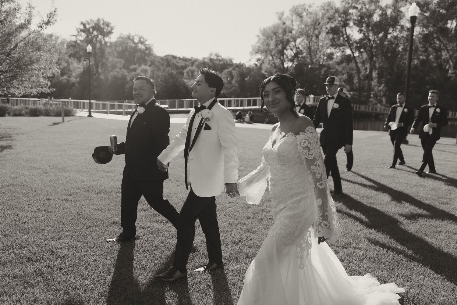Black and white collage of wedding moments showing couples dancing and celebrating outdoors in a park setting.