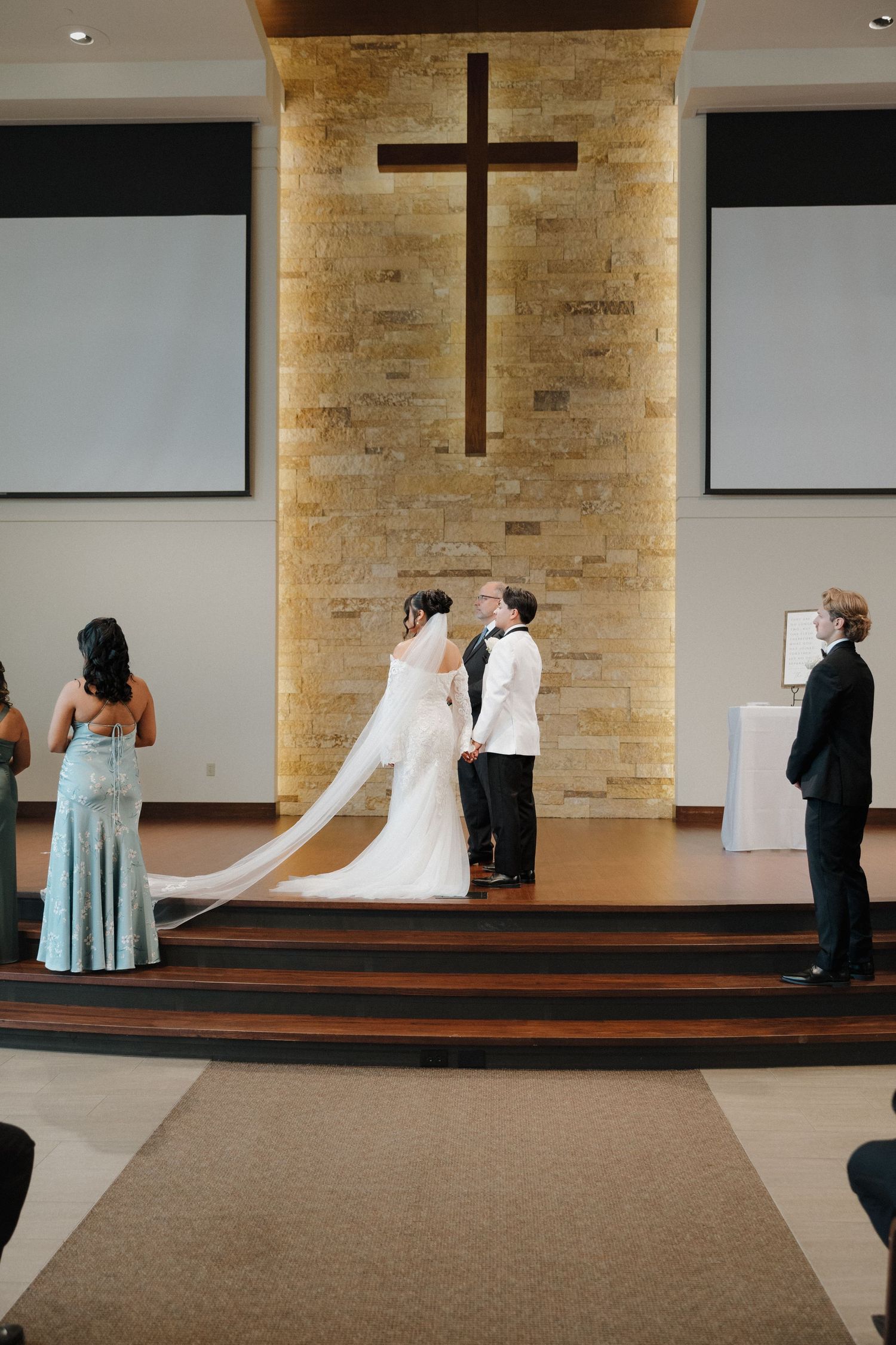 A sequence of wedding ceremony photos showing formal poses on church steps with a wooden cross in the background.