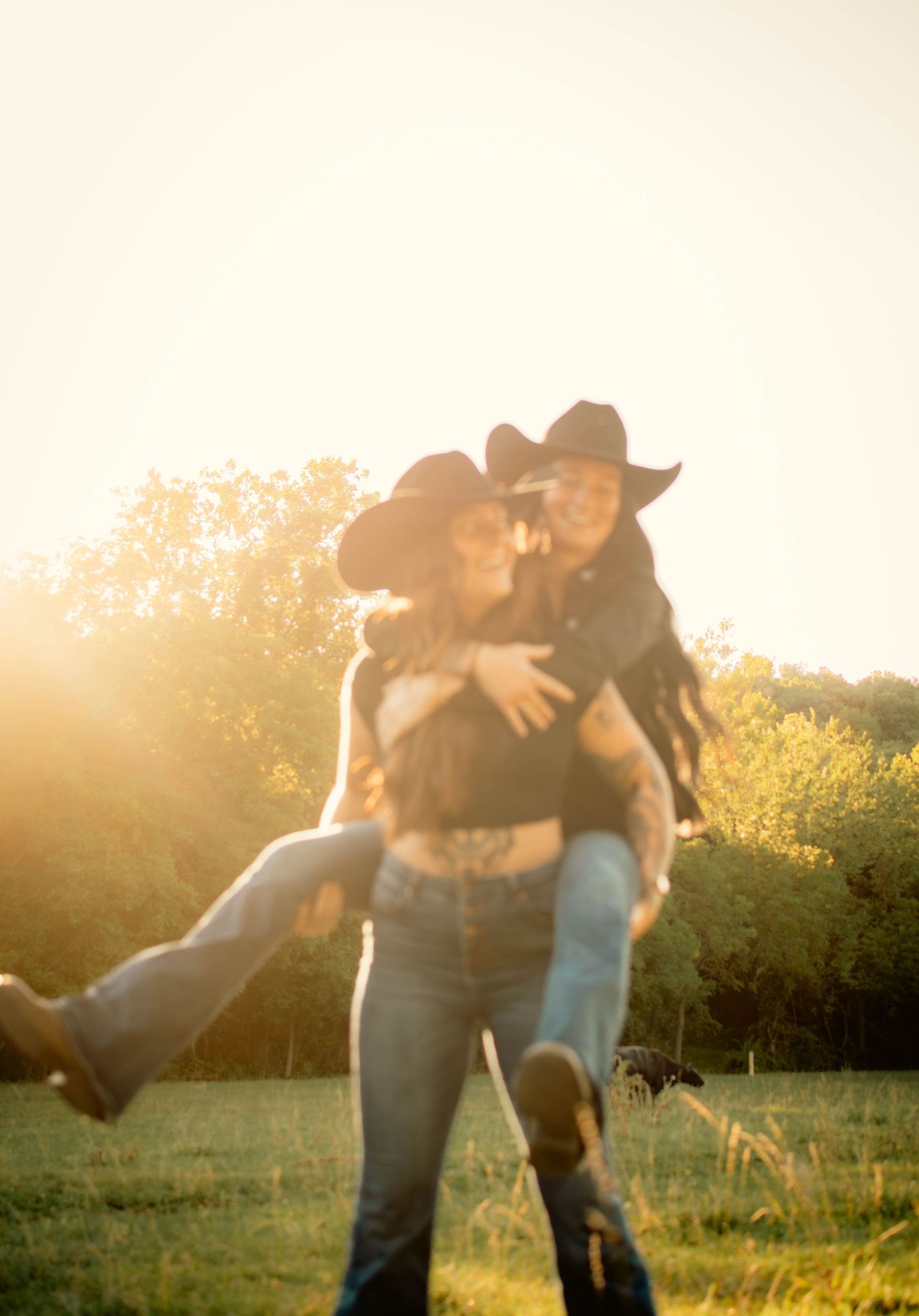 Playful dip pose in field during golden hour photoshoot.