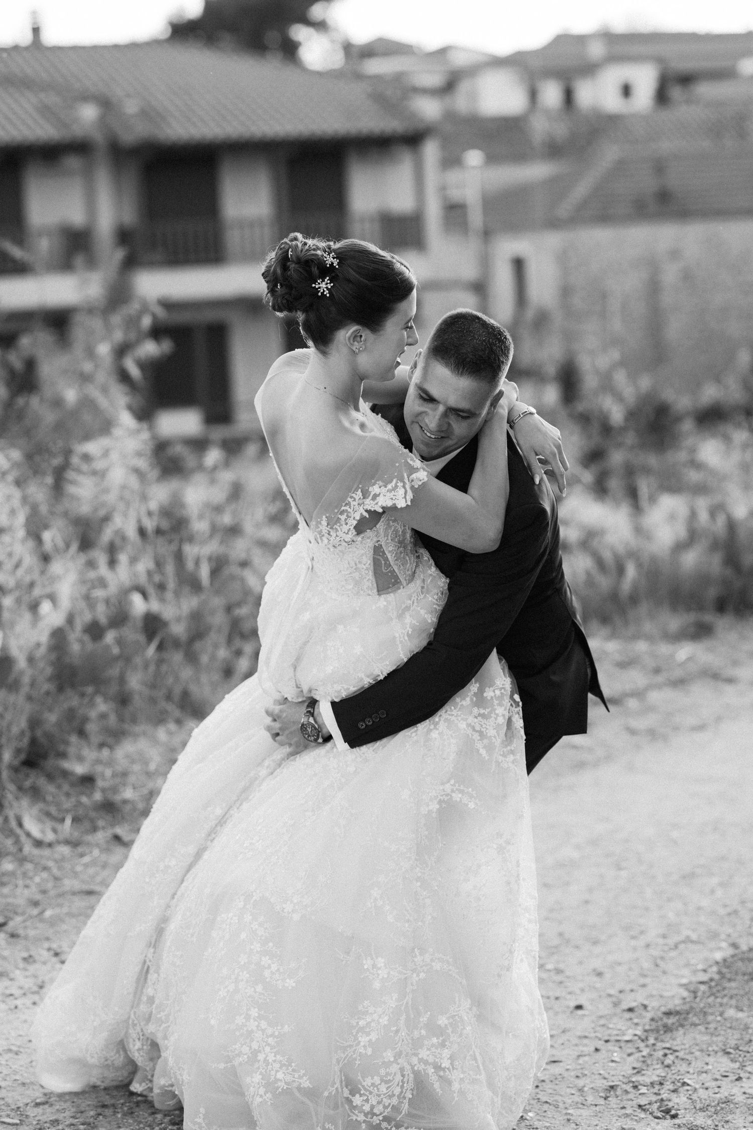Black and white wedding portraits showing intimate moments between newlyweds.