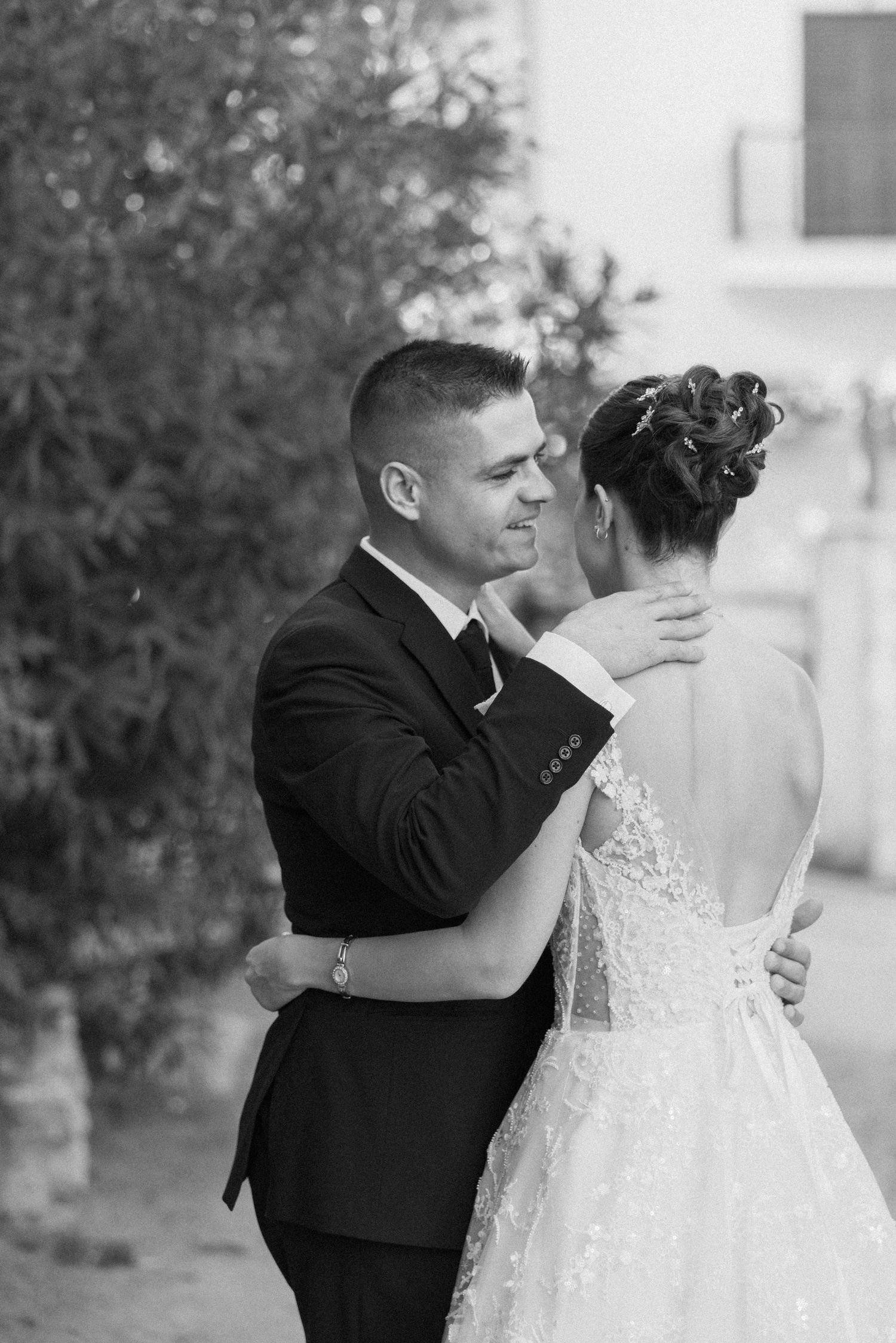 Black and white romantic wedding portraits showing tender moments between newlyweds.