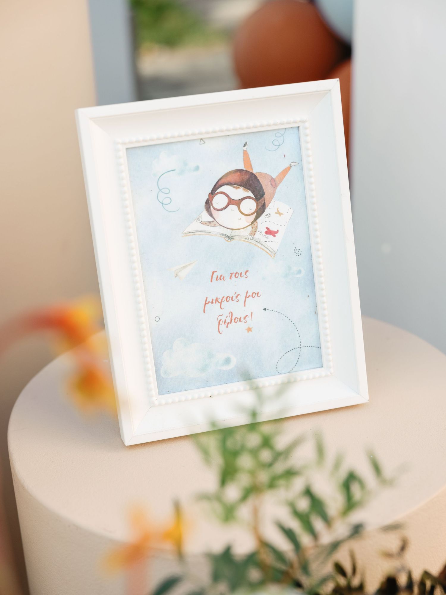 Small decorative cards with handwritten text displayed in a row against a soft blurred background with floral elements.