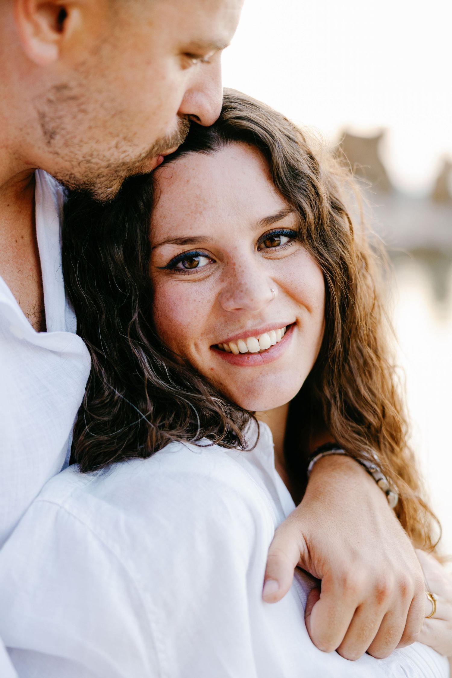 Intimate close-up portraits of a couple sharing loving glances and smiles.