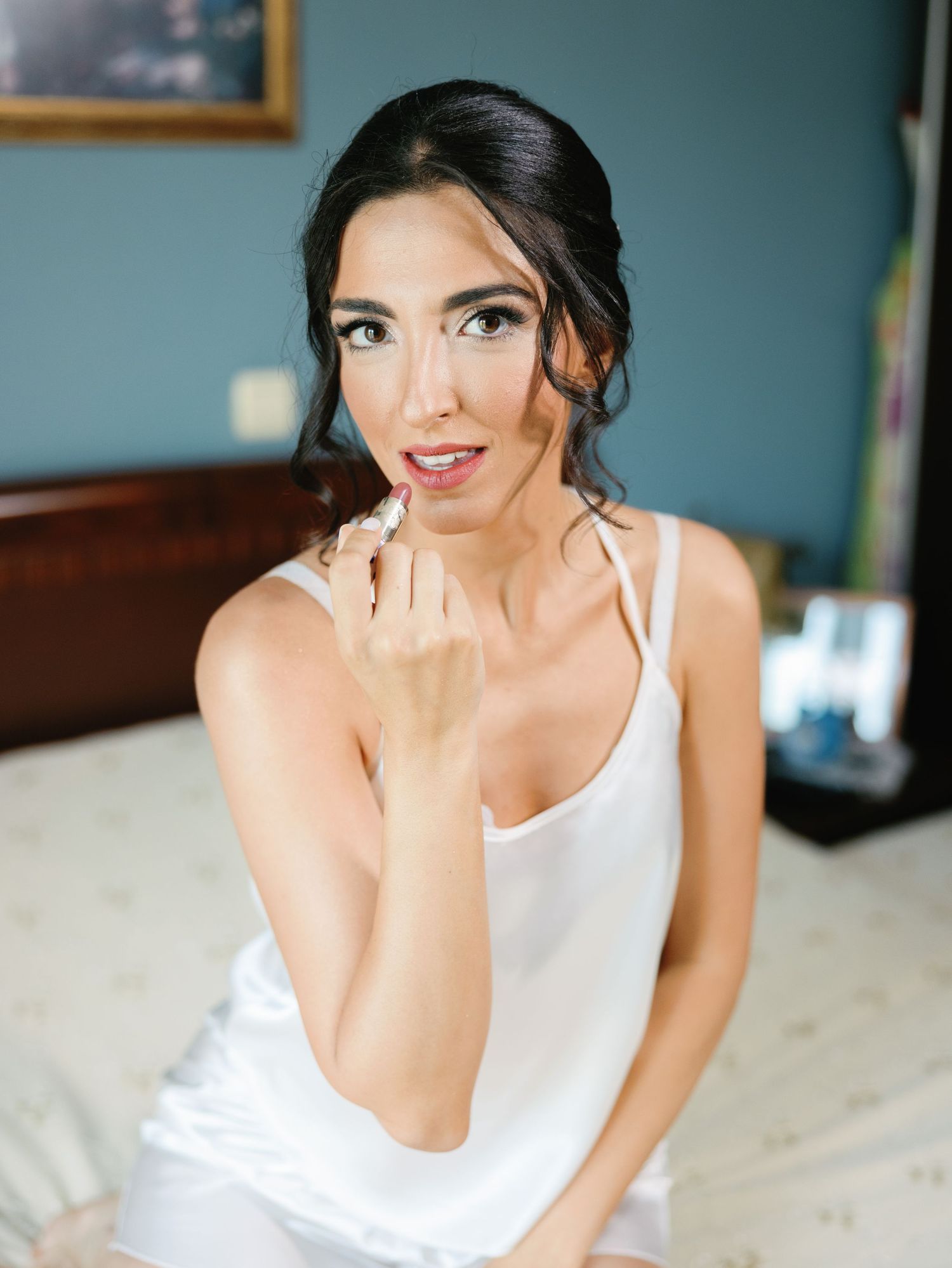 Intimate portrait series on bed with white lingerie and natural window light.