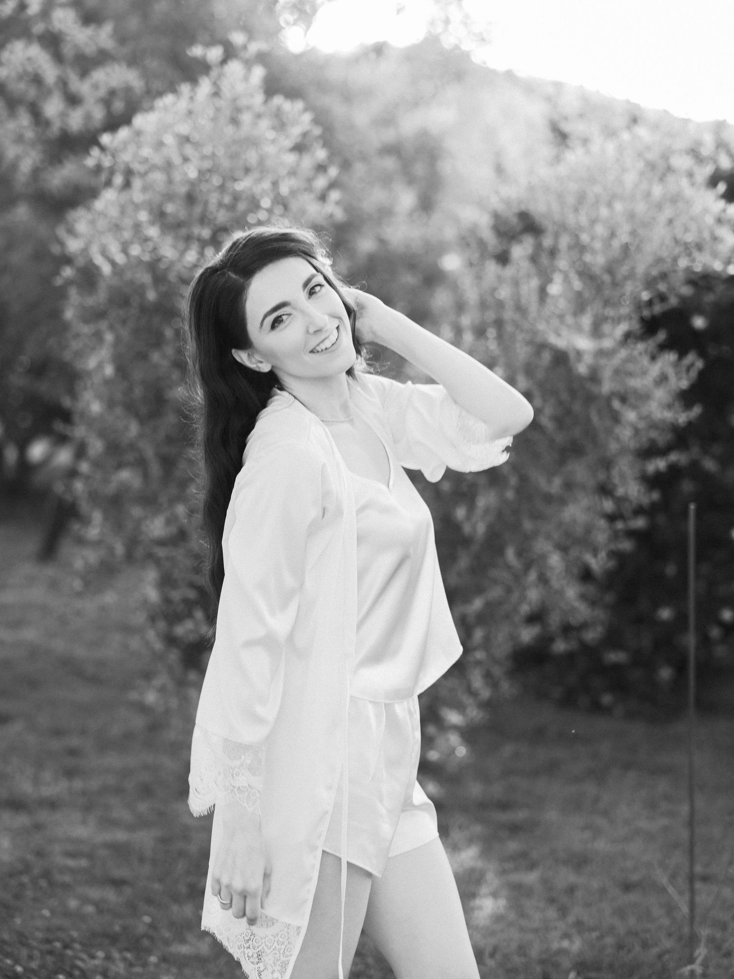 Black and white outdoor portrait series featuring elegant white clothing.