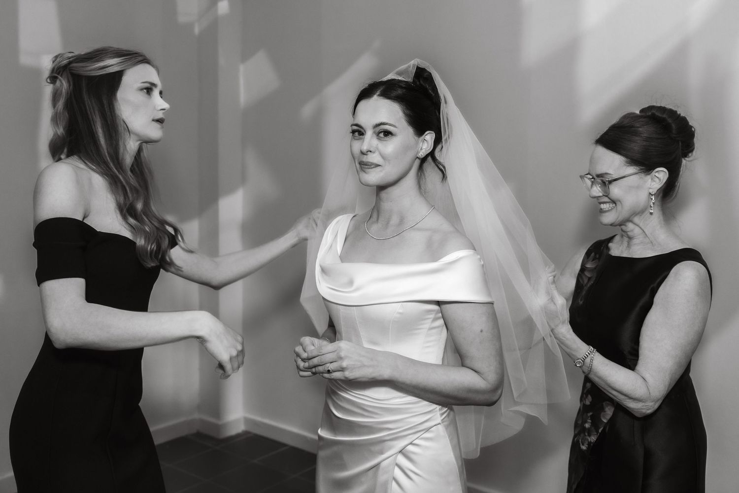 Black and white series of elegant bridal preparation moments.