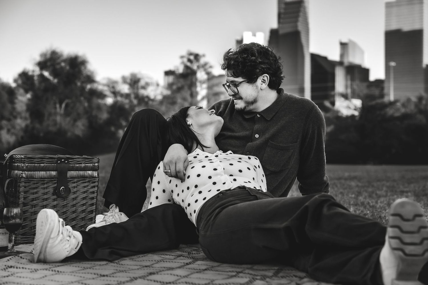 Black and white photo series showing romantic couple moments on a couch.