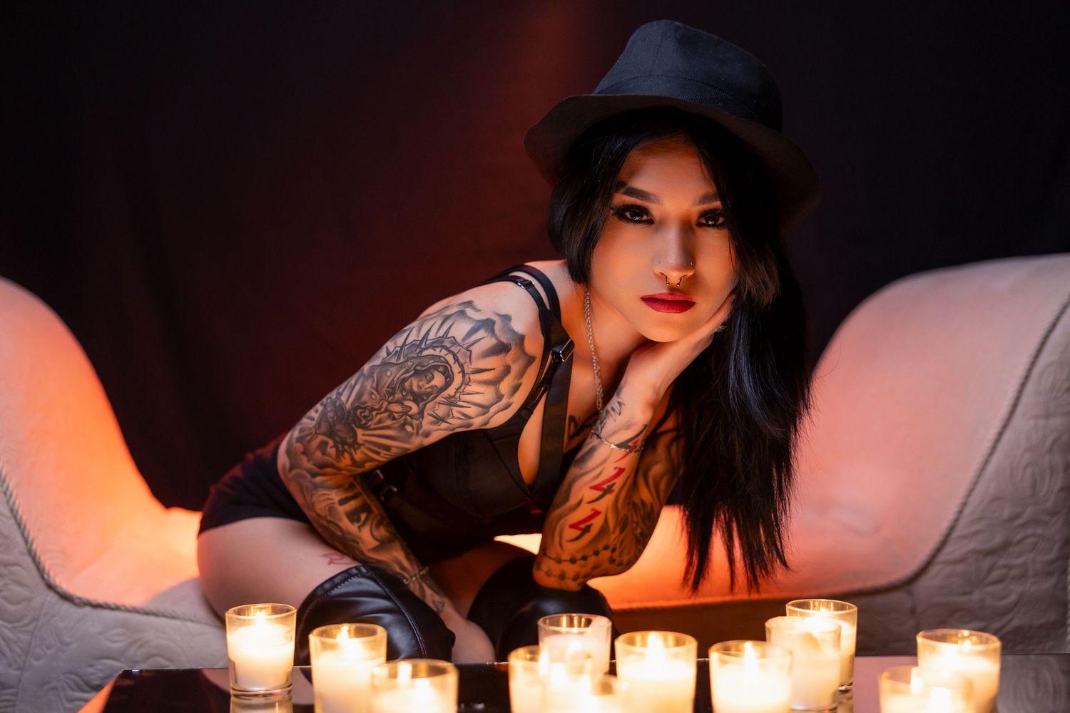 Moody portrait with candlelight creating dramatic shadows and illumination.