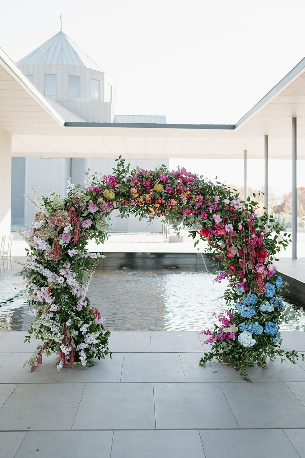 Editorial and luxury floral centerpiece and ceremony archway at the Hall of Lights venue.