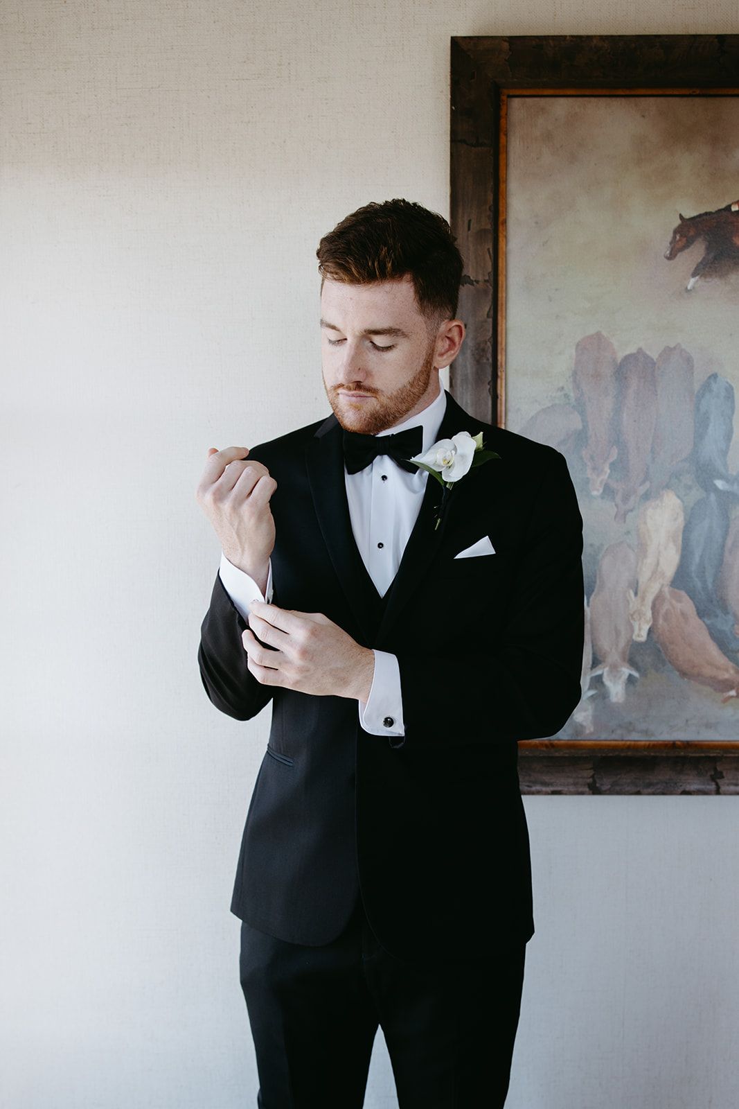 Luxury and editorial groom getting ready portraits at the Hotel Drover.