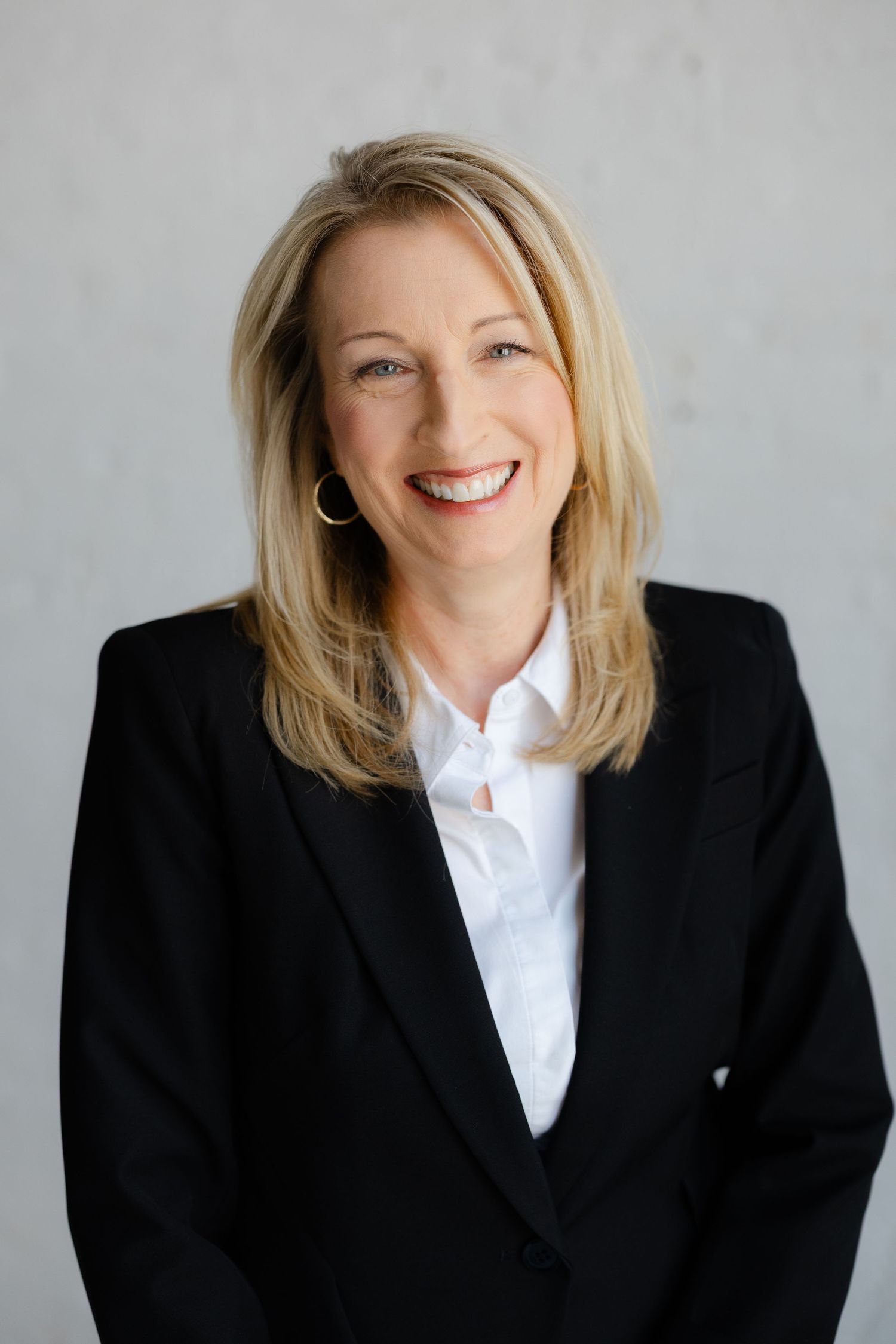 Professional headshot of a smiling businesswoman photographed in Dayton, Ohio.