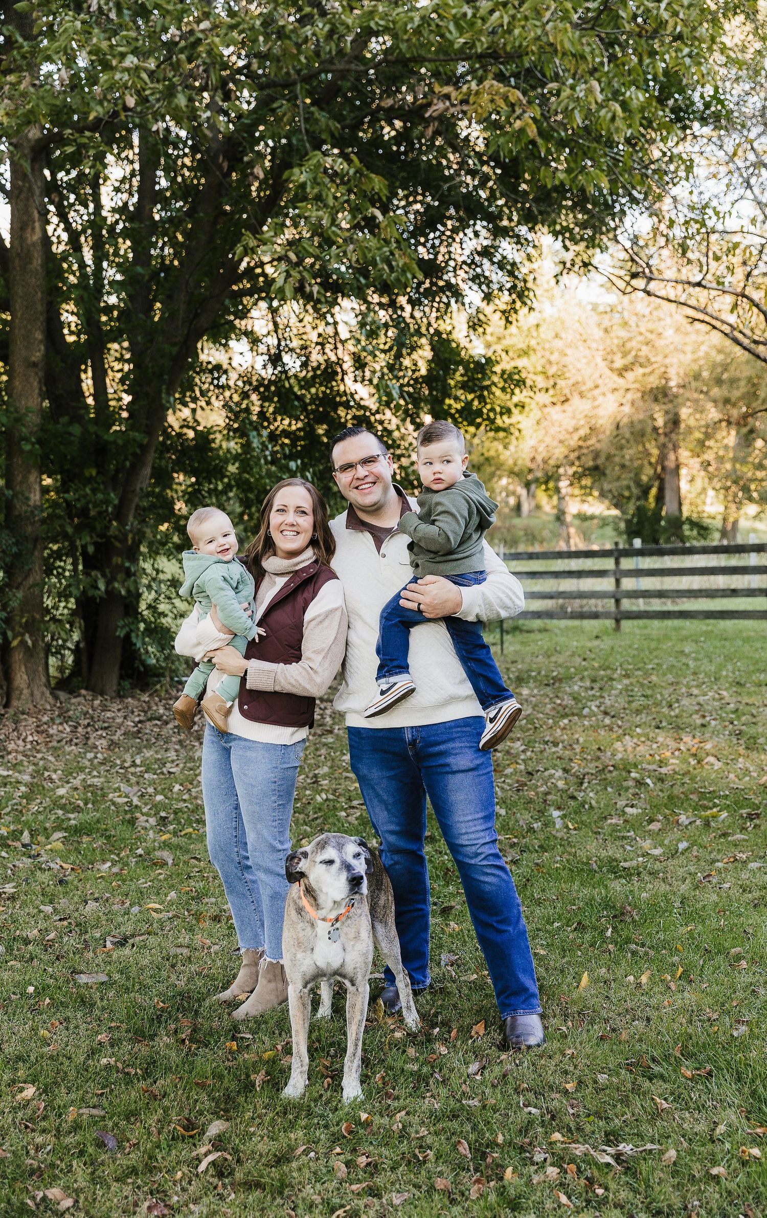 Family of four with their dog during an outdoor family portrait session near Dayton, Ohio.
