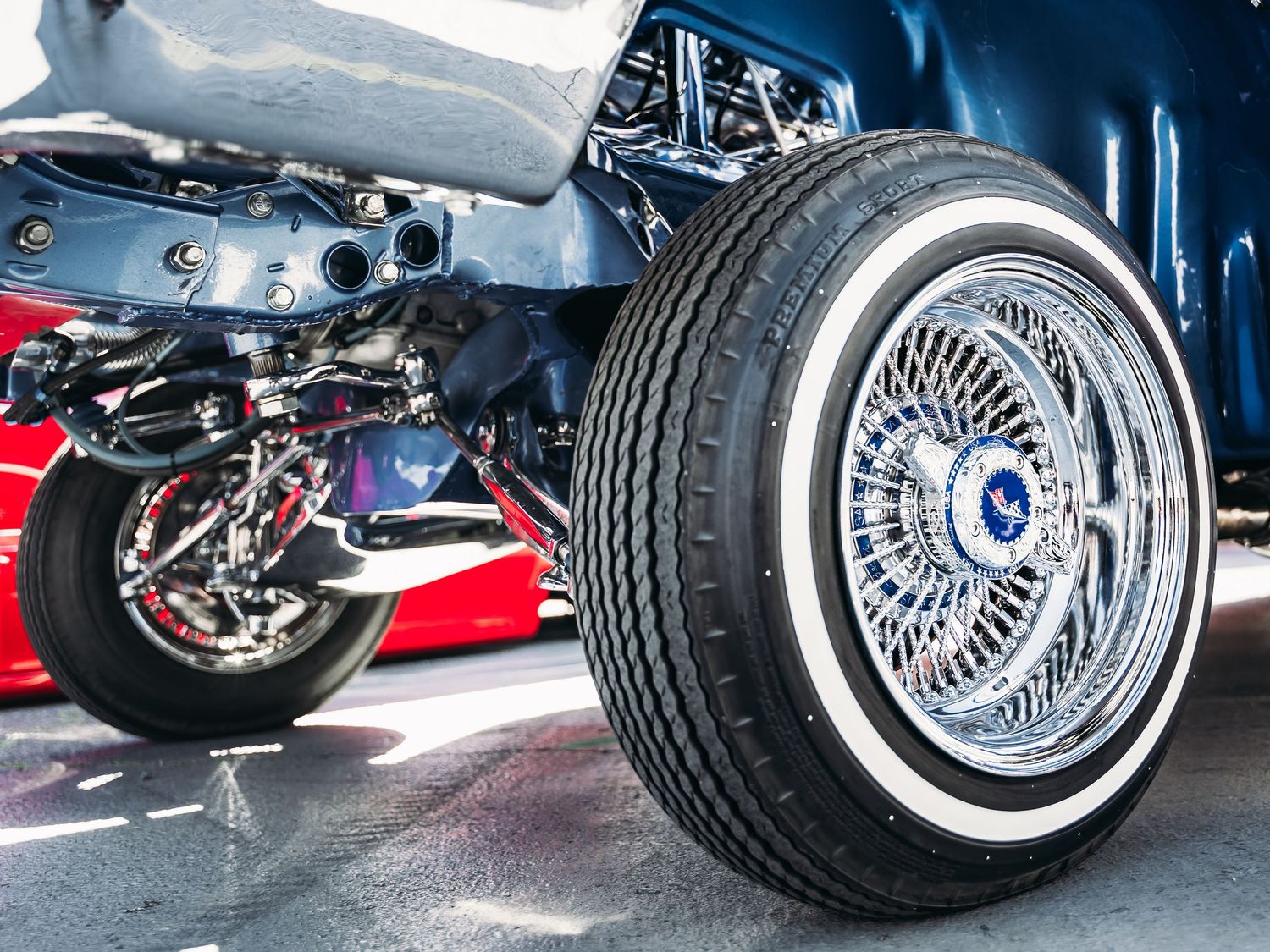 Close-up of a chrome wire wheel with whitewall tire on a classic lowrider car at Super Saturday Weekend at The STRAT in Las Vegas