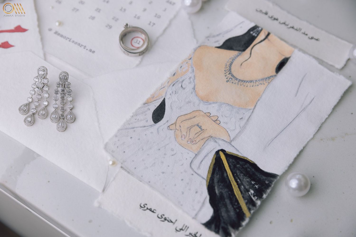 Wedding invitation suite featuring peach and navy illustrations with pearl embellishments.