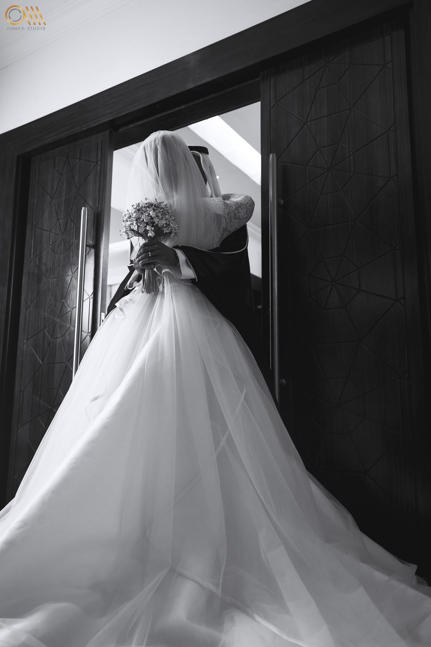 Black and white images showing the intricate details of a wedding dress train against dark walls.
