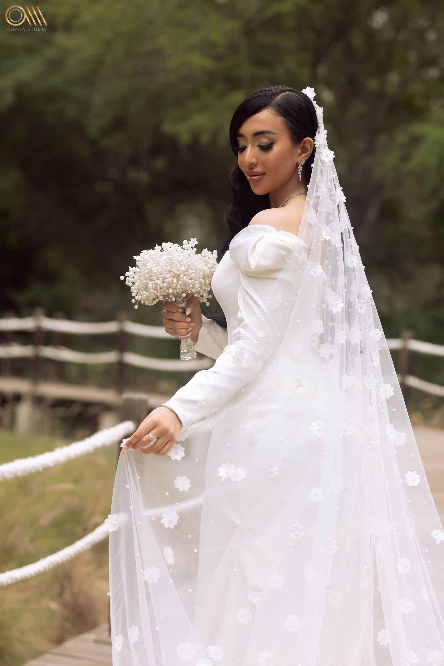Elegant bridal portrait series featuring a delicate floral veil and white bouquet in an outdoor setting.