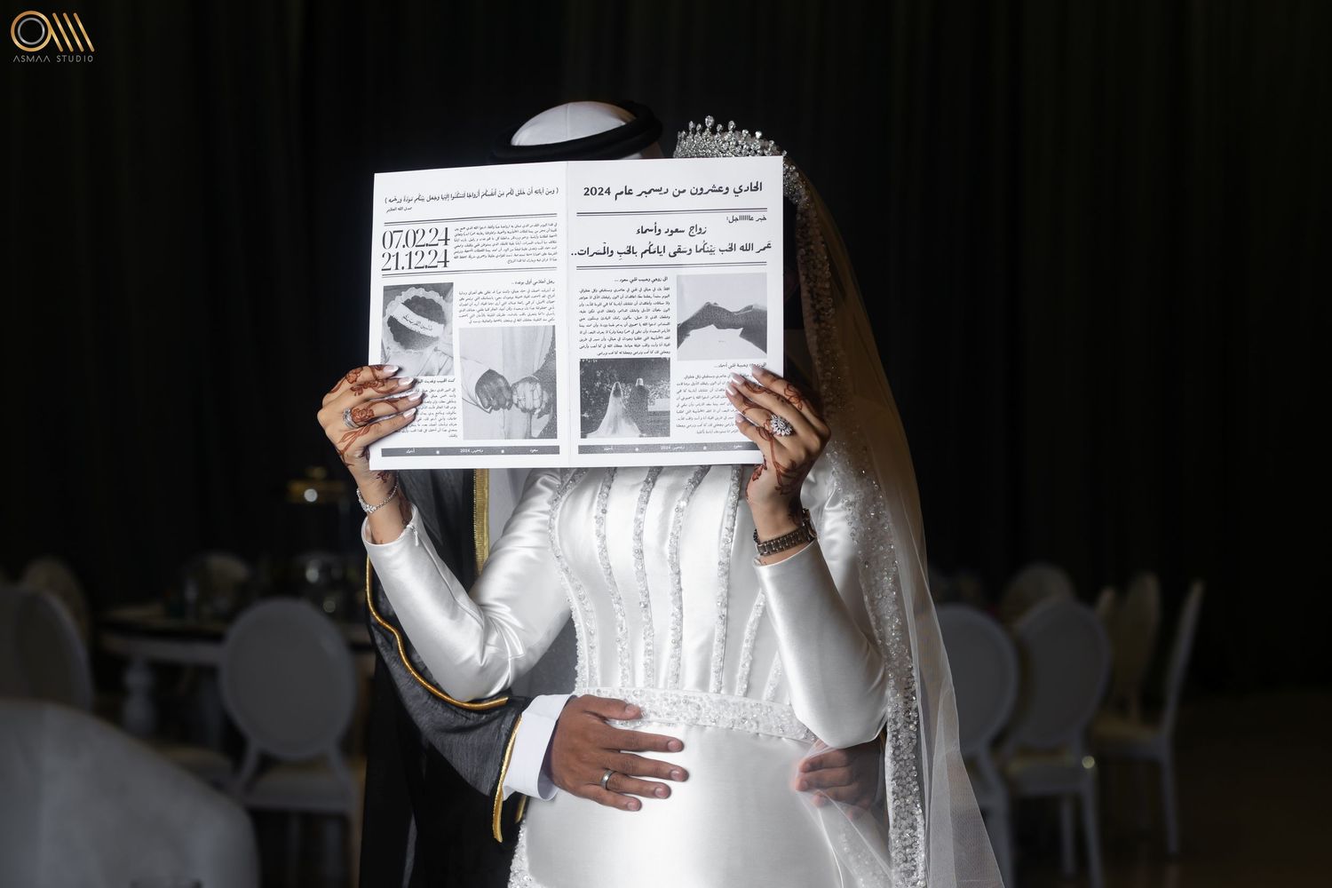 Hands holding a wedding-themed newspaper or publication during a ceremony.