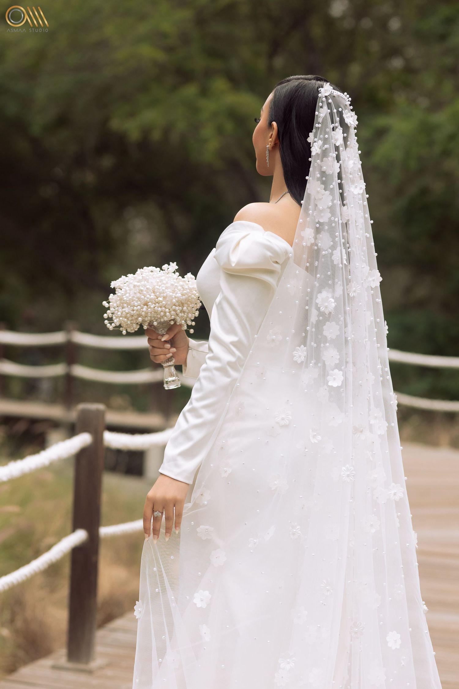 Close-up shots of a wedding dress and floral veil details against a rustic fence backdrop.
