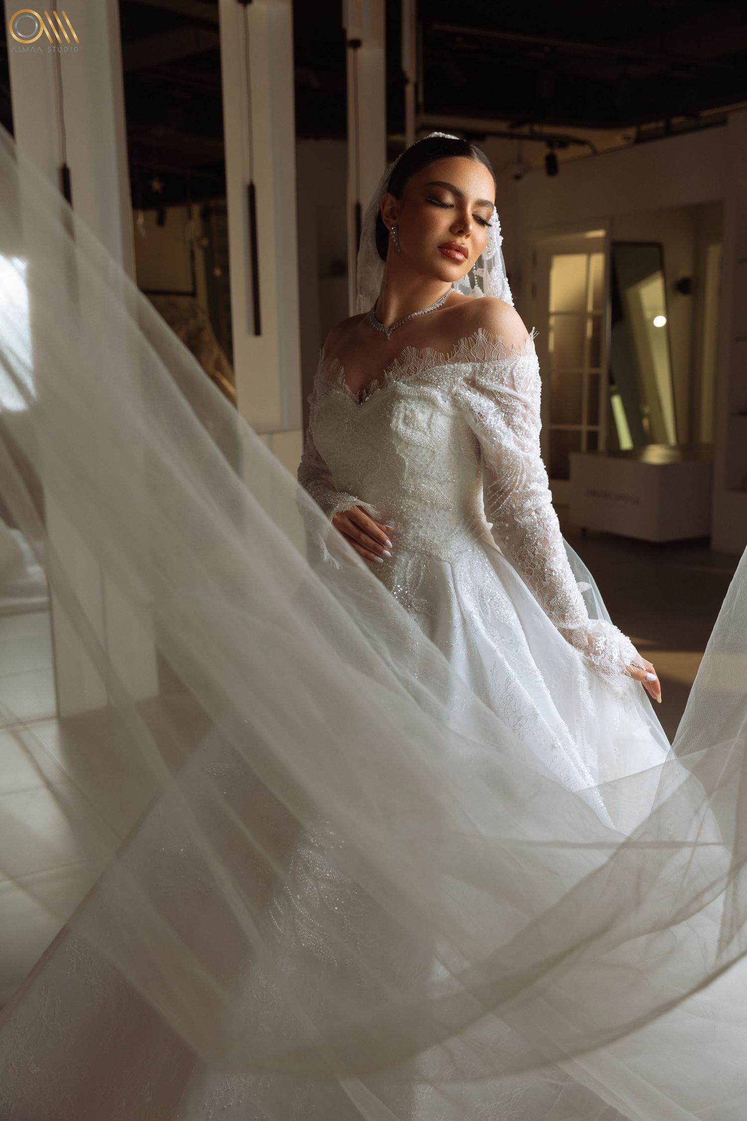 Ethereal wedding dress with lace details and billowing skirt captured in artistic motion.