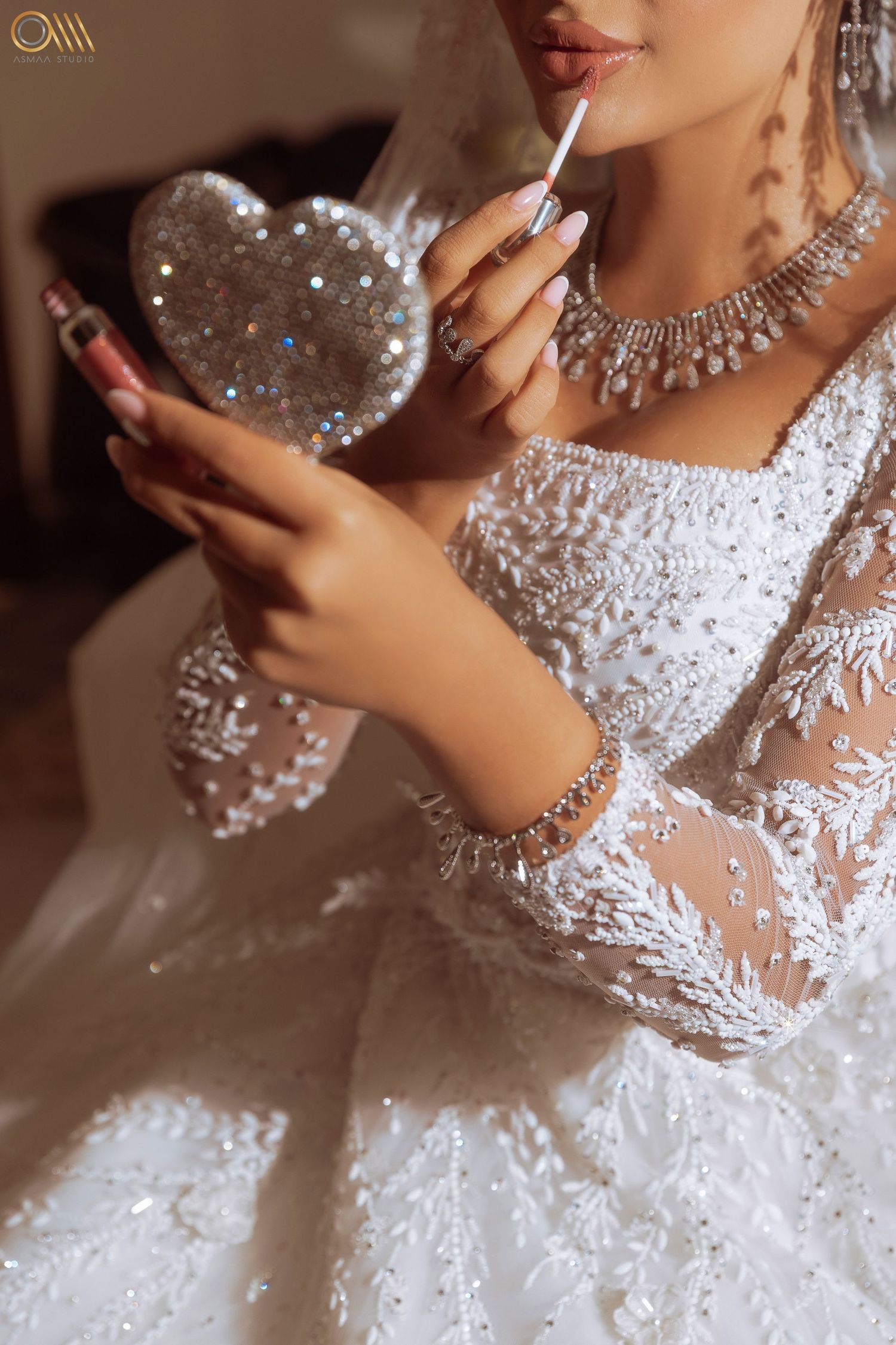 Close-up of sparkling bridal jewelry and beaded wedding dress details.