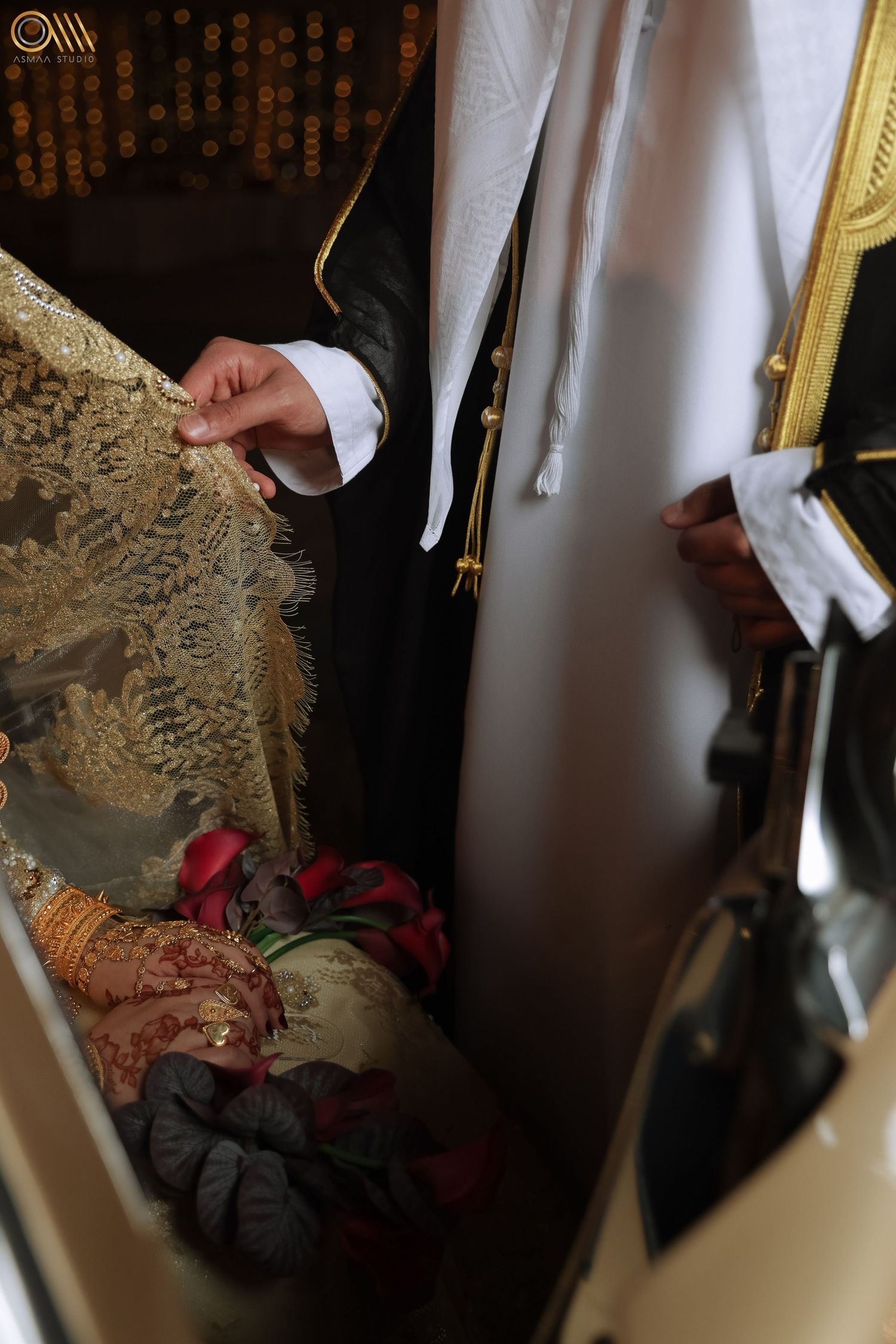 Close-up view of intricate lace details and embellishments on a wedding dress.