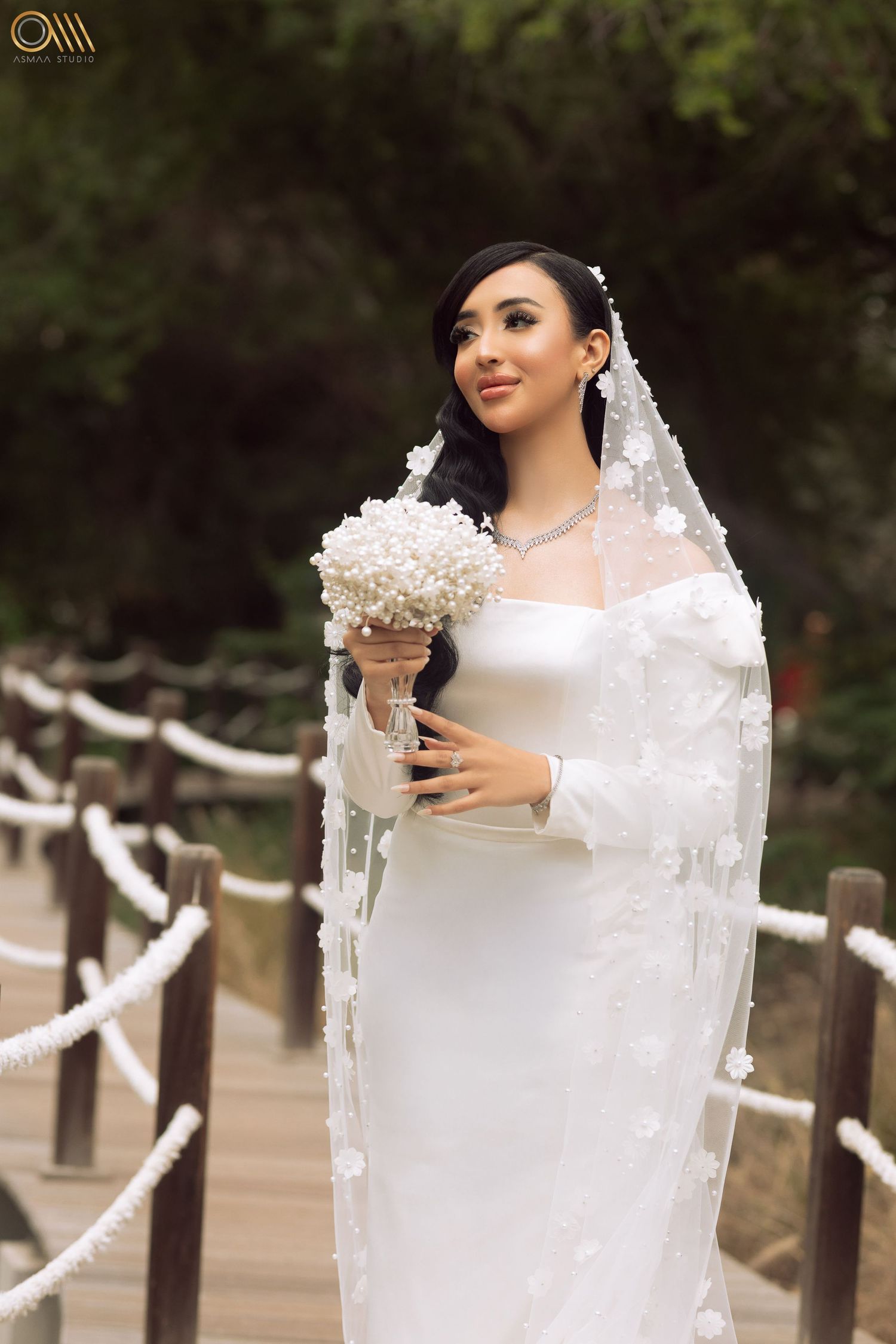 Outdoor bridal photography sequence featuring a delicate veil and white bouquet near wooden fencing.