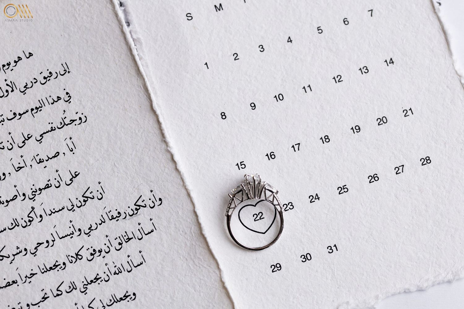 Arabic calendar pages with elegant calligraphy and dates displayed in sequence.