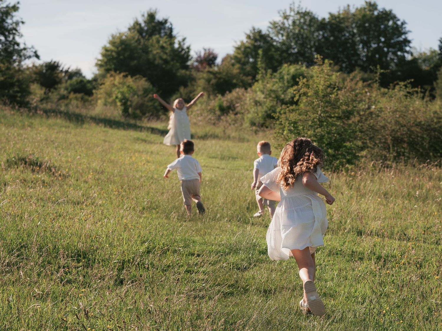 Candid photo of children racing up hill