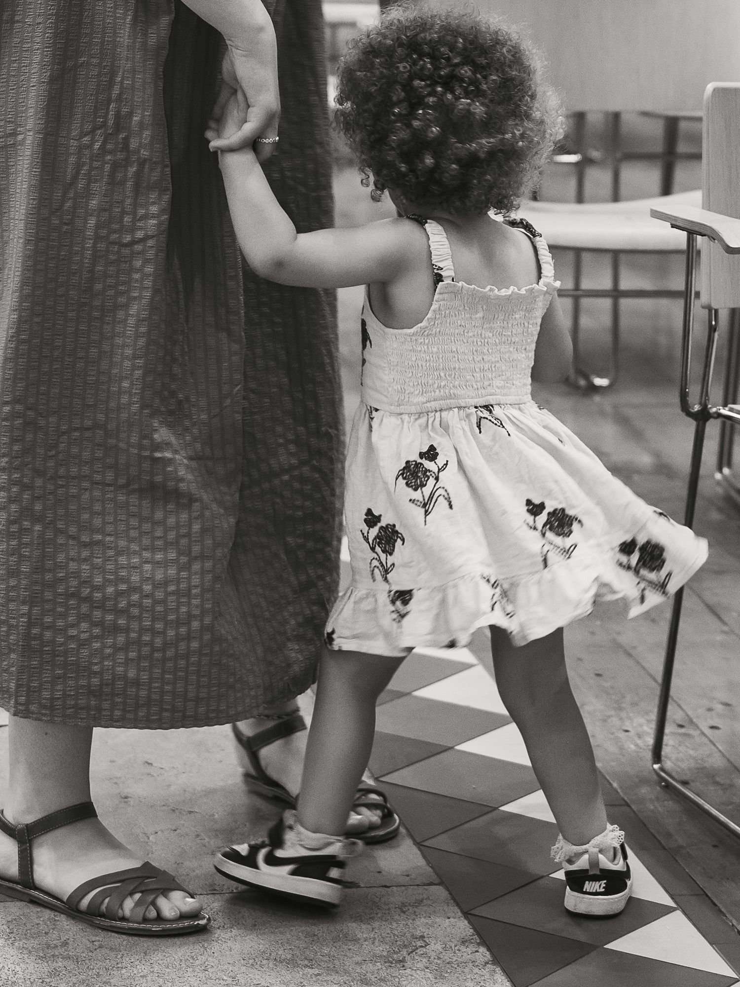 Candid of toddler dancing with mum