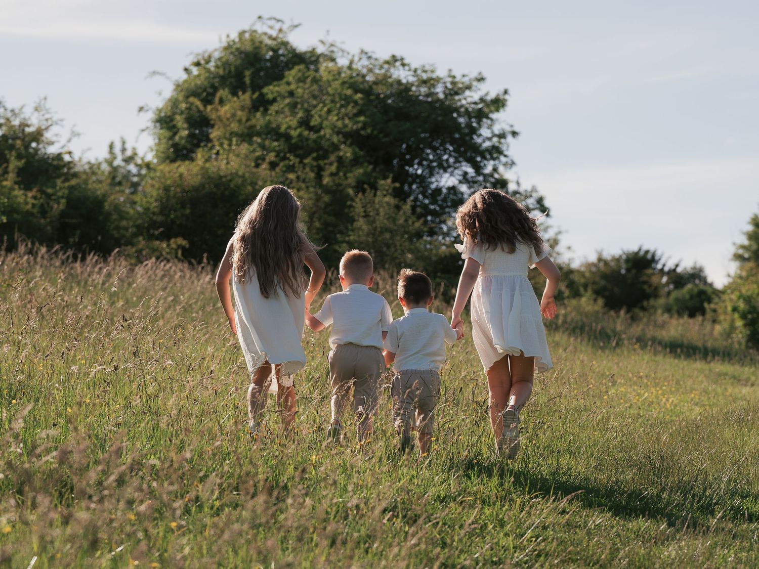 Children walking together in golden hour