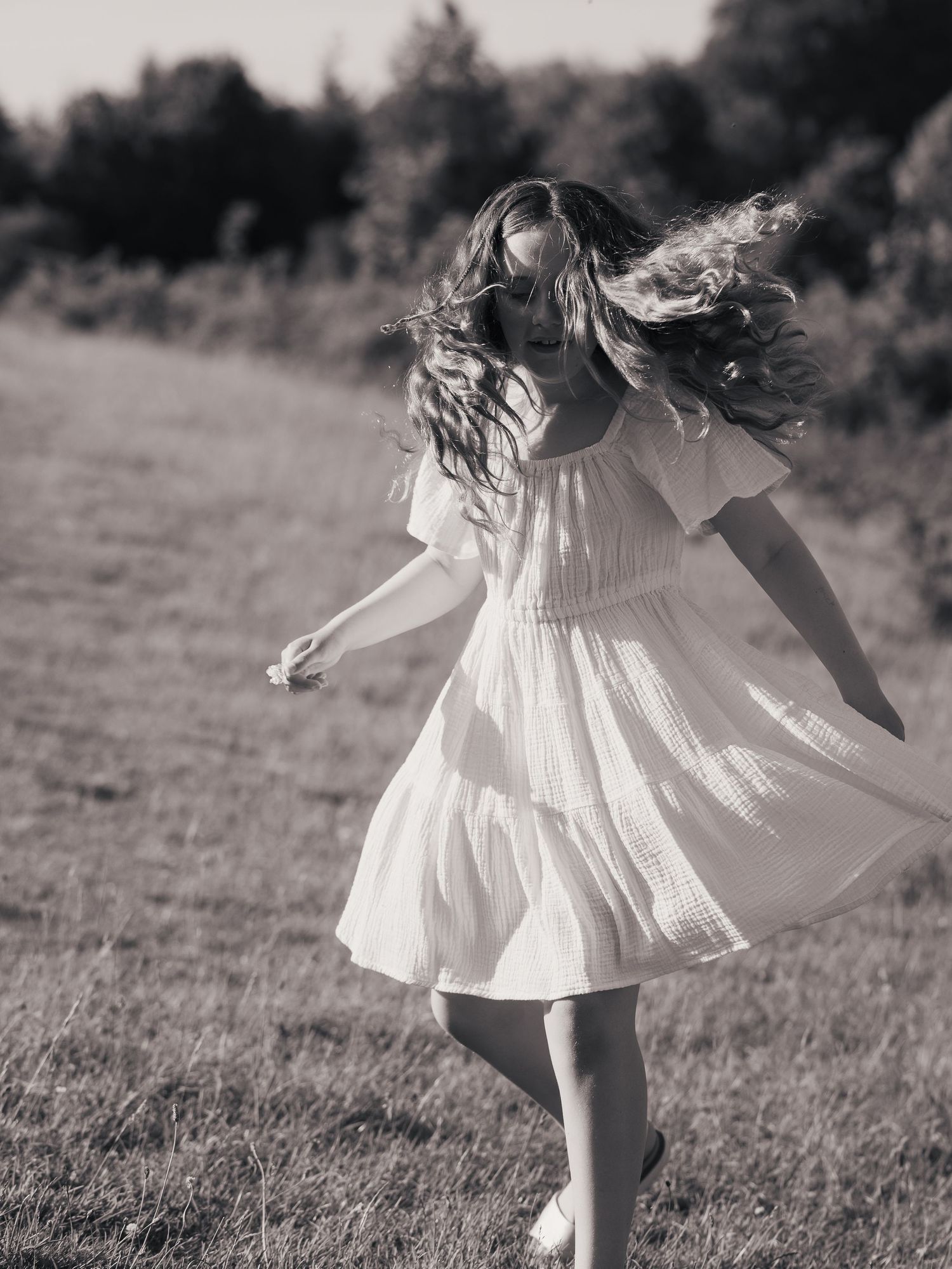 Child twirling documentary photo